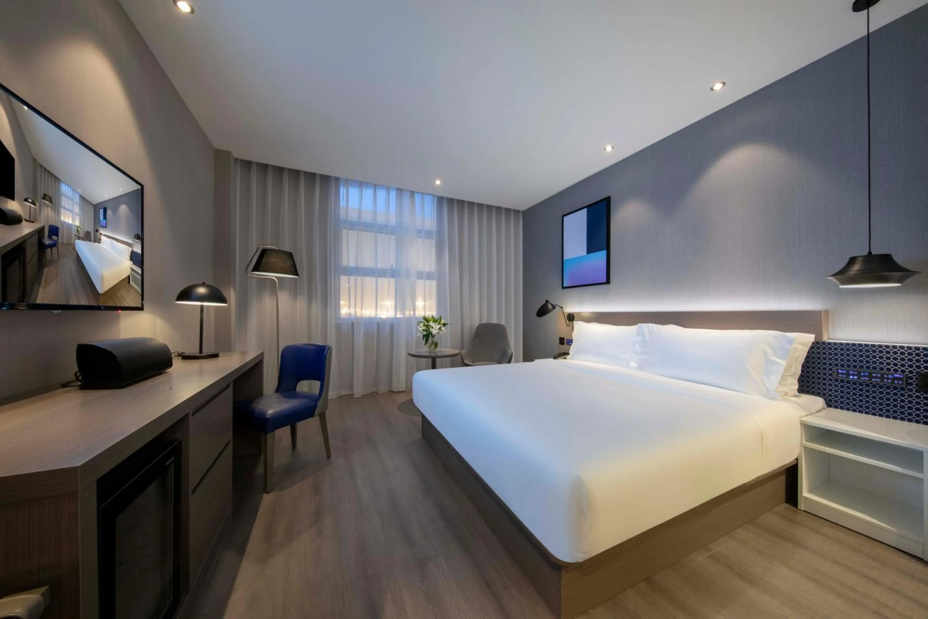 Bed in Orange Hotel Shanghai Hongqiao Railway Station Qixin Road (formerly Hongqiao National Exhibition and Convention Center Qixin Road Branch)