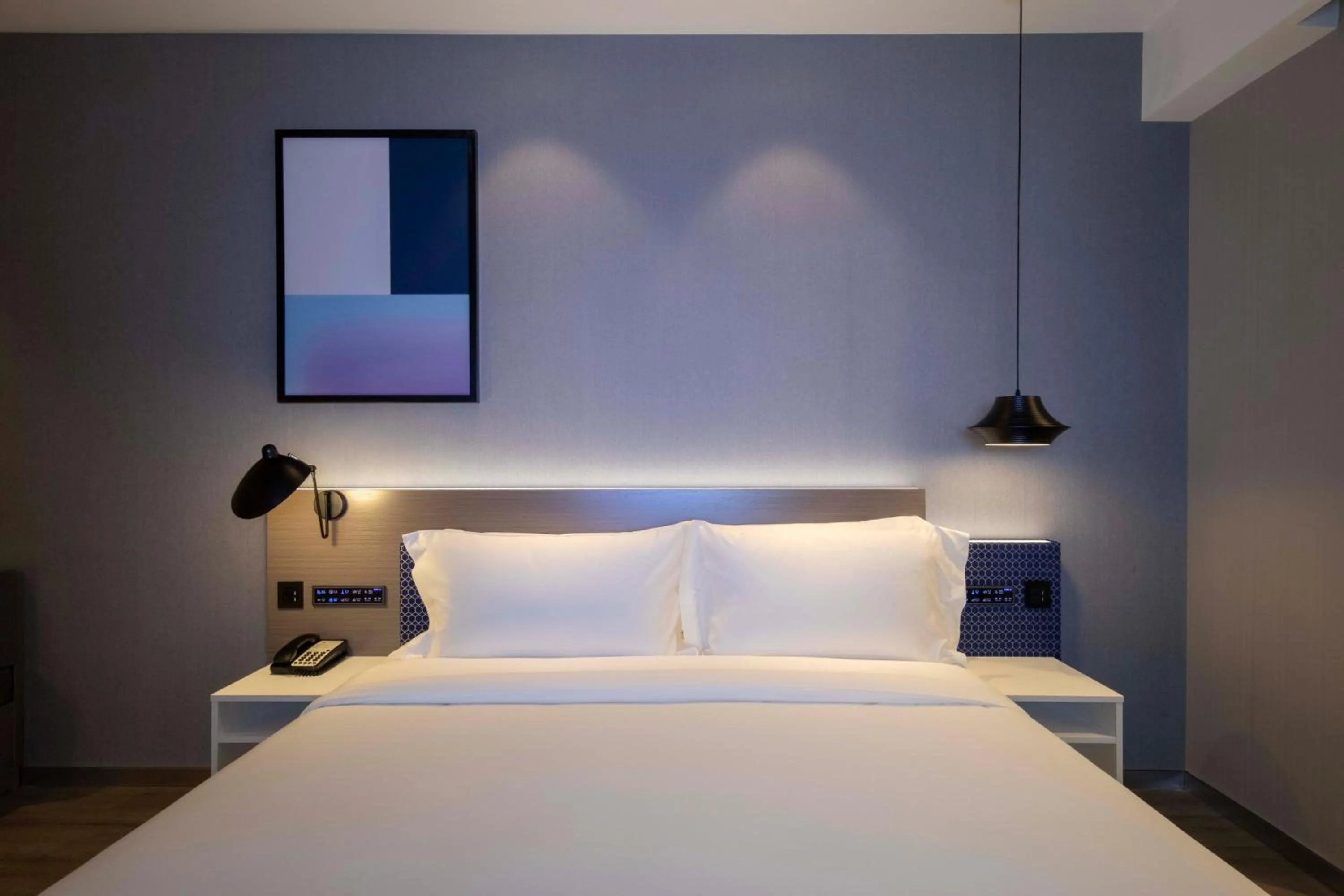 Bed in Orange Hotel Shanghai Hongqiao Railway Station Qixin Road (formerly Hongqiao National Exhibition and Convention Center Qixin Road Branch)