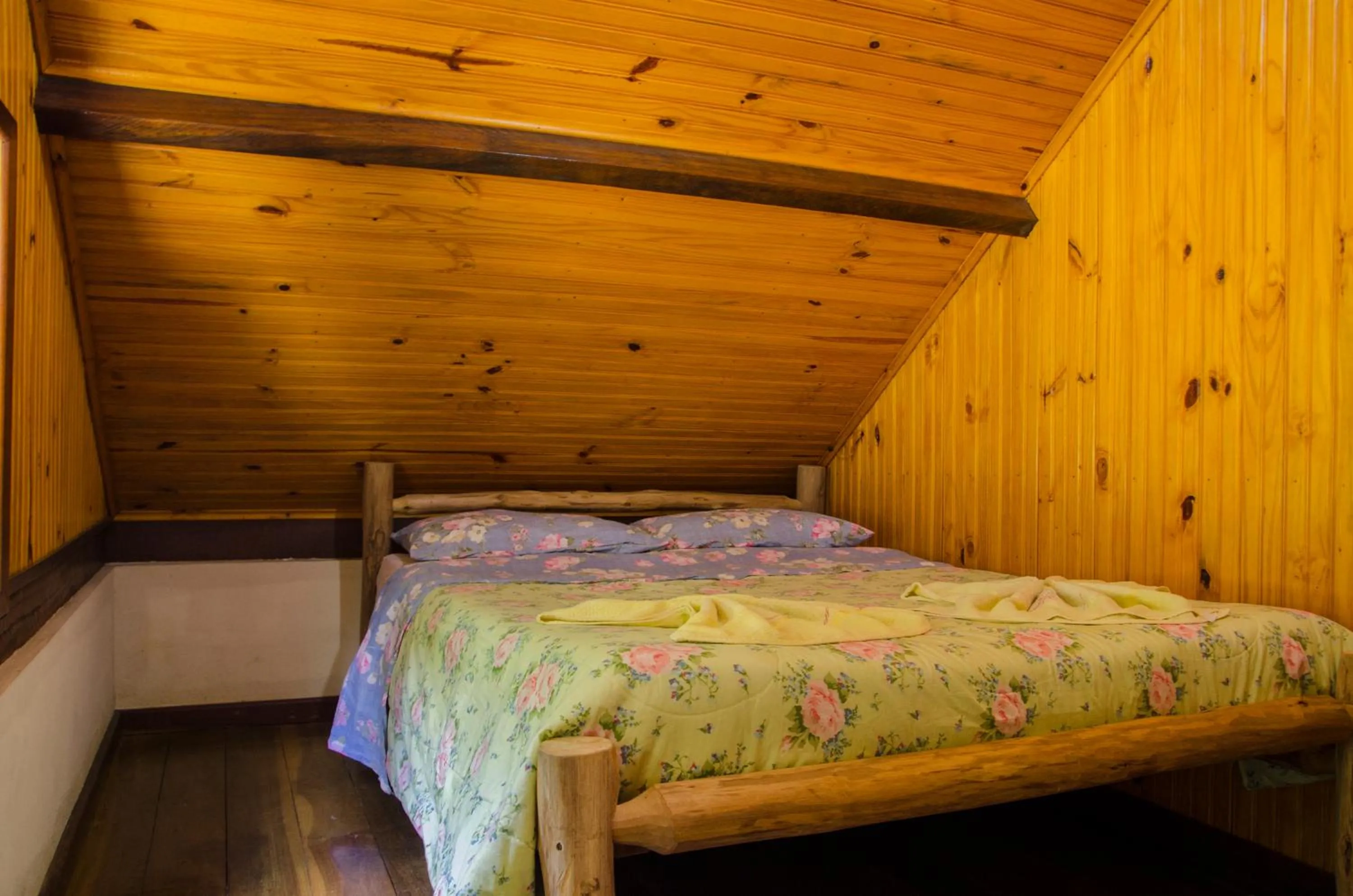 Bed in Chalés Lirio dos Vales