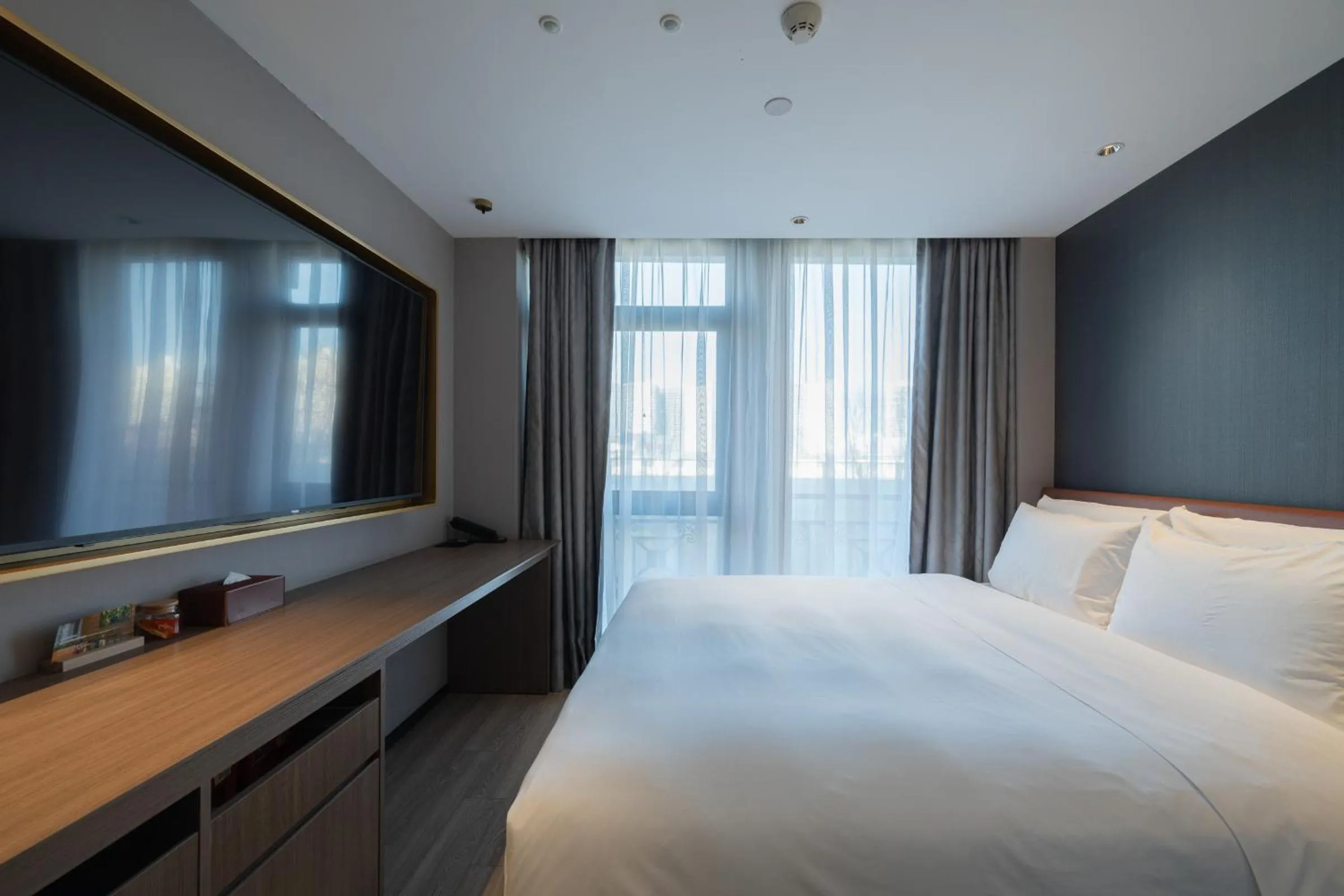Bed in Orange Hotel Beijing West Railway Station Lianbao Road