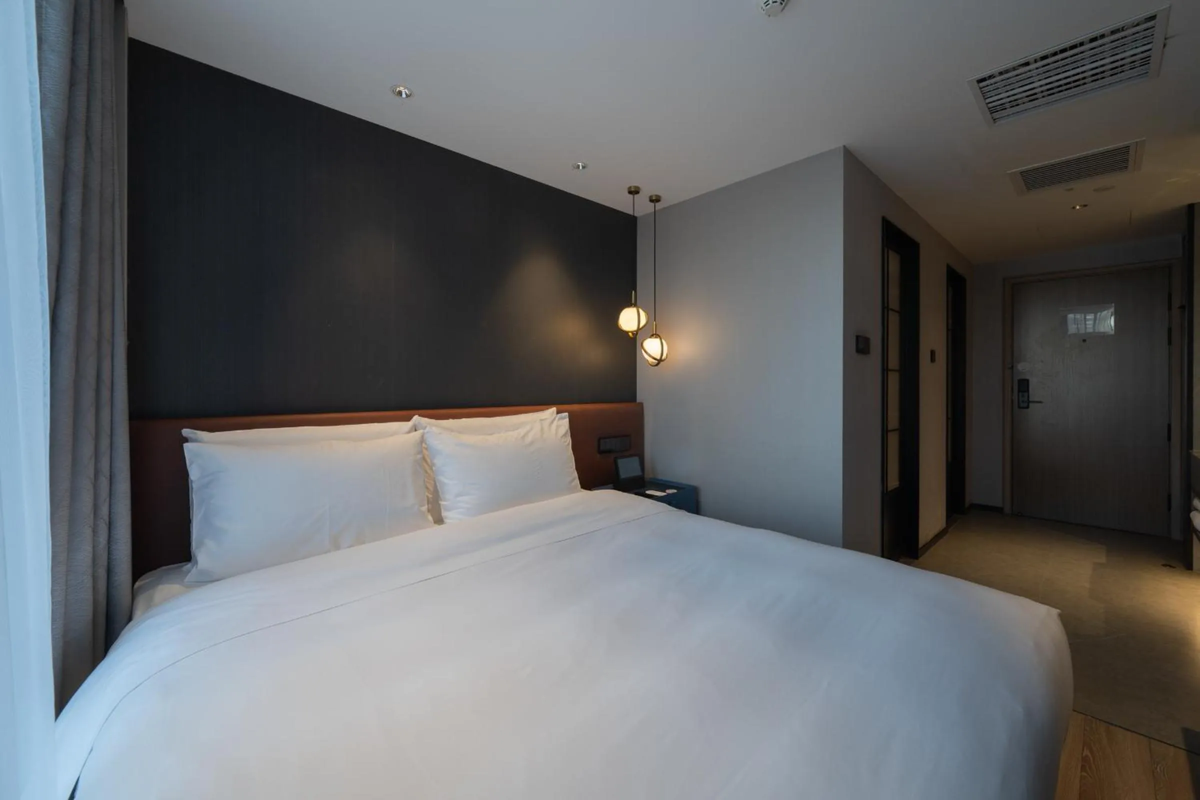 Bed in Orange Hotel Beijing West Railway Station Lianbao Road