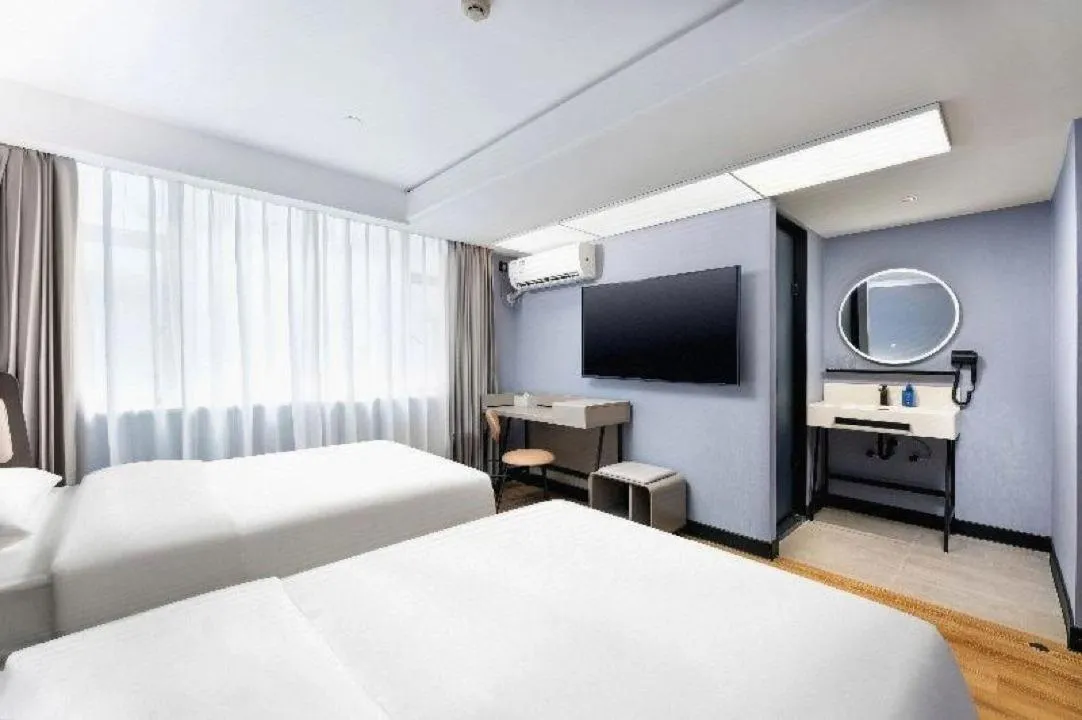 Bed in Hanting Hotel Guangzhou Sanyuanli