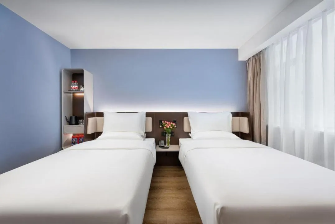 Bed in Hanting Hotel Guangzhou Sanyuanli