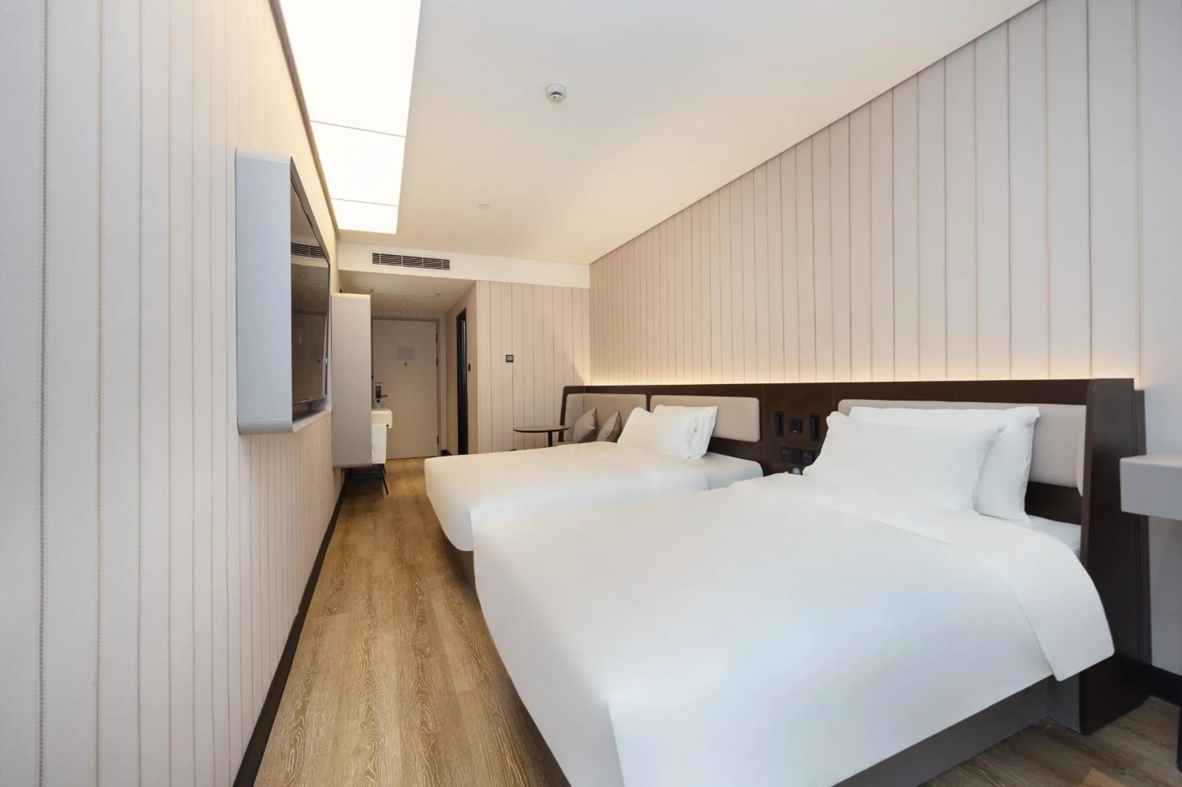 Bed in Hanting Hotel Shanghai Yishan Road Center