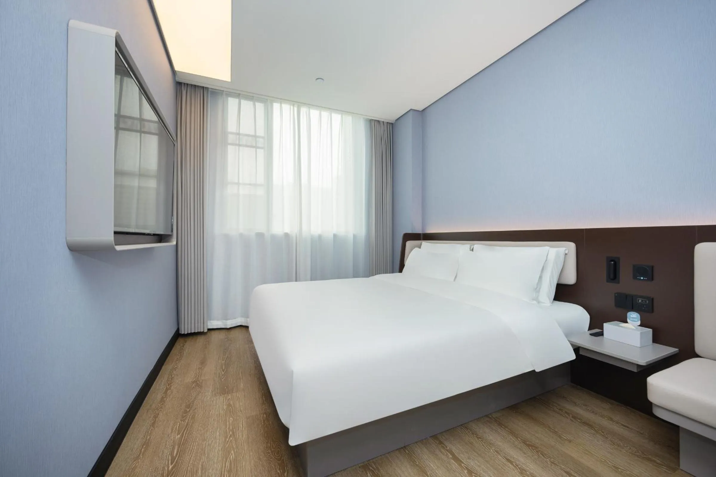 Bed in Hanting Hotel Shanghai Yishan Road Center