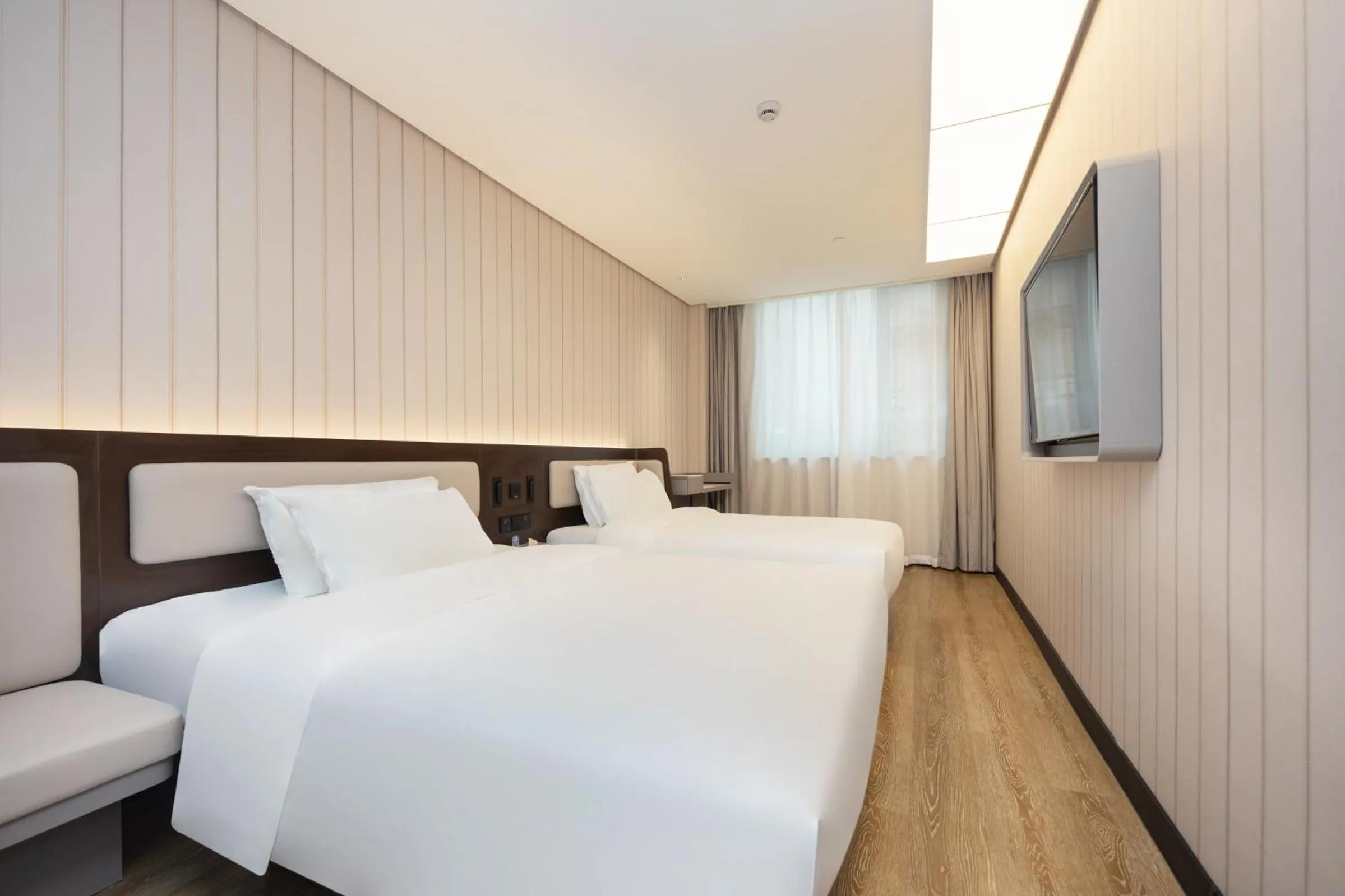 Bed in Hanting Hotel Shanghai Yishan Road Center