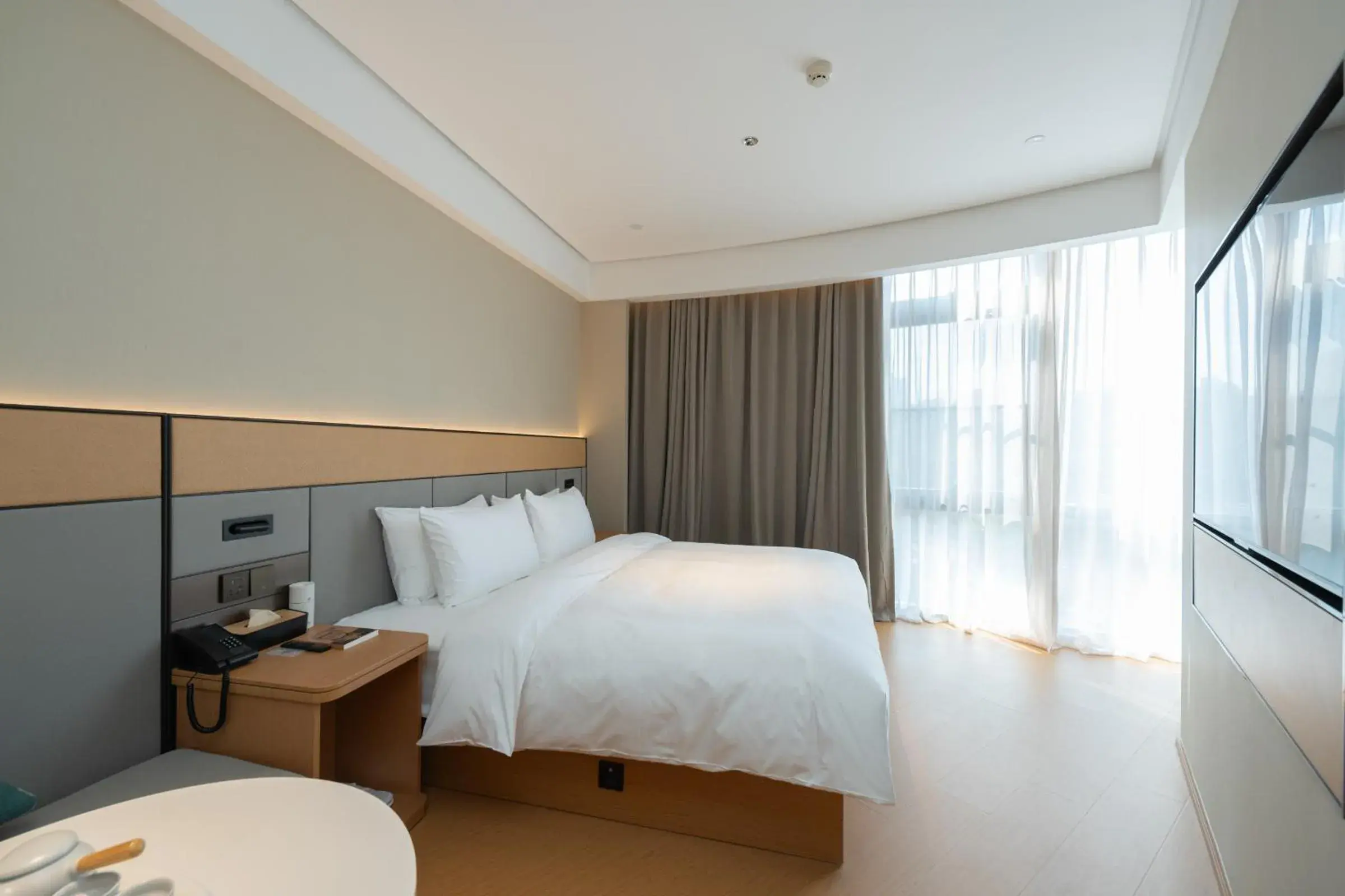 Bed in JI Hotel Guangzhou Panyu Chimelong Wanbo Center Bed in JI Hotel Guangzhou Panyu Chimelong Wanbo Center