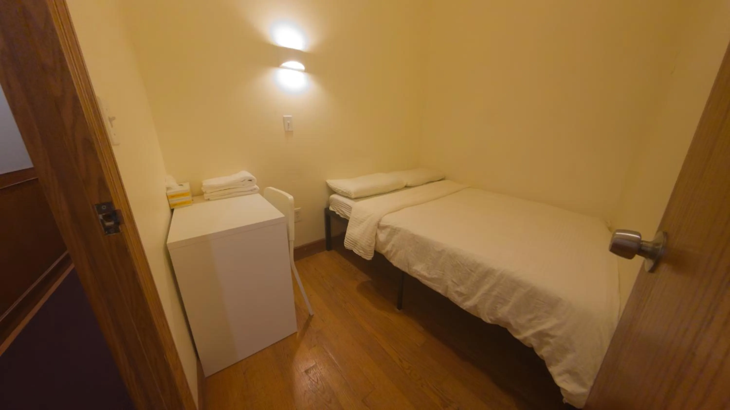 Bed in U.S. Pacific Hotel