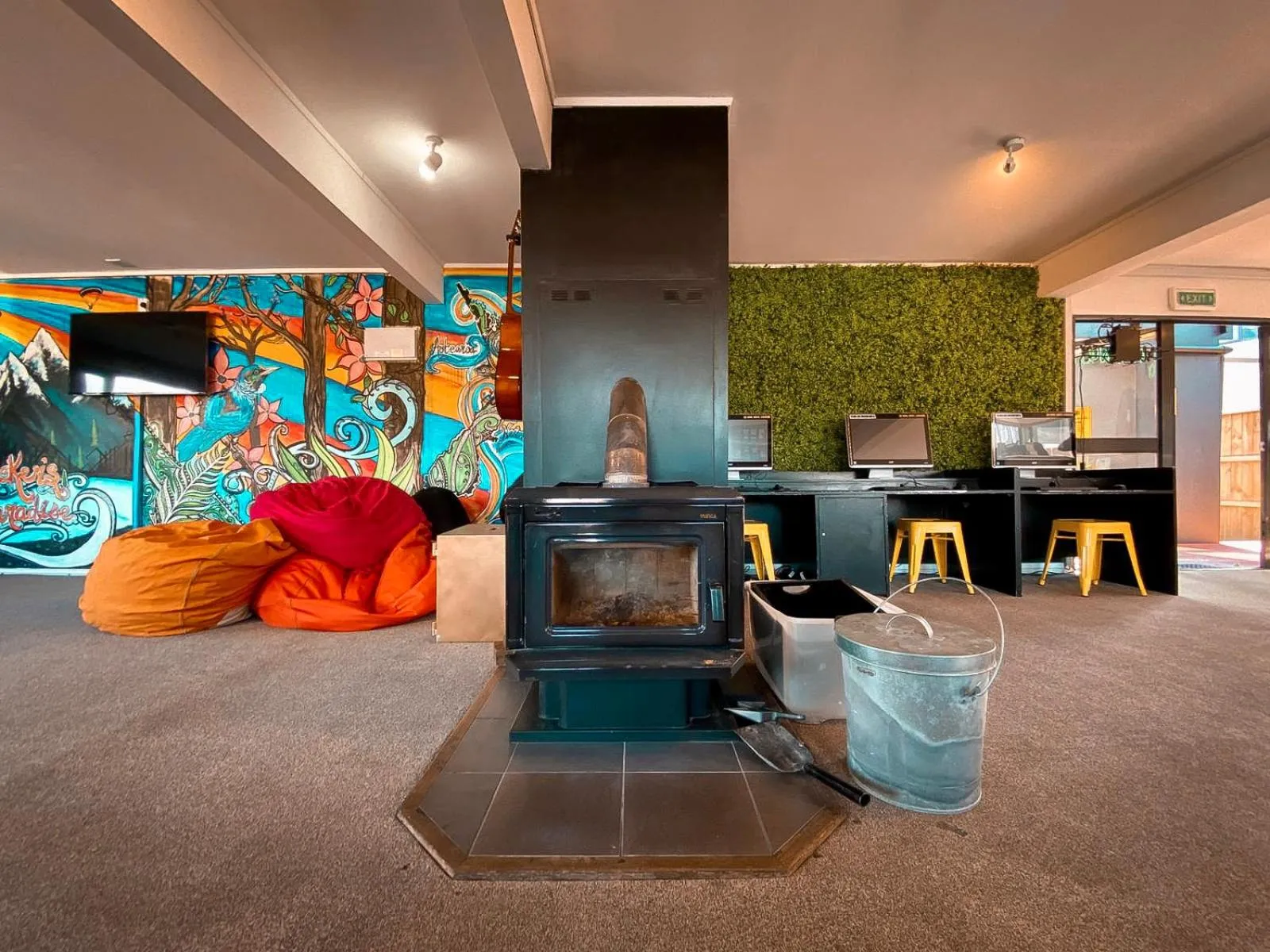 Communal lounge/ TV room in The Black Sheep Backpackers