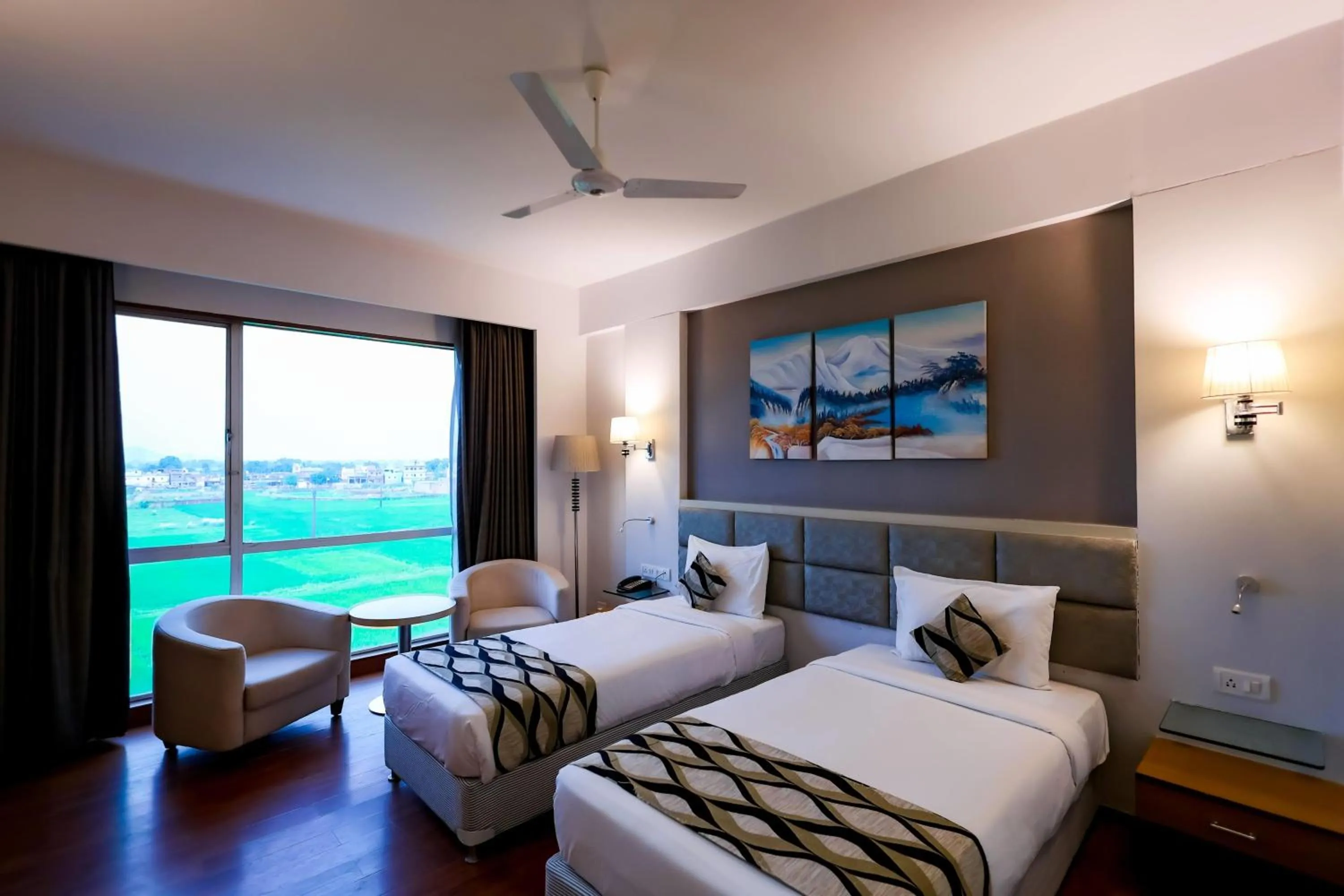 Photo of the whole room, Bed in Ramada by Wyndham Bodh Gaya Mahabodhi