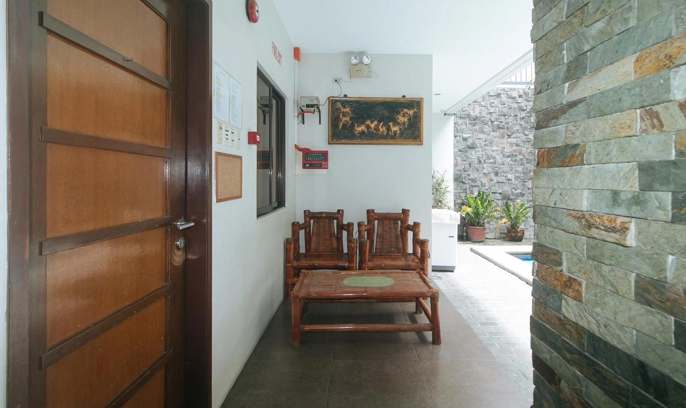 Seating area in Elyseah Condotel by RedDoorz