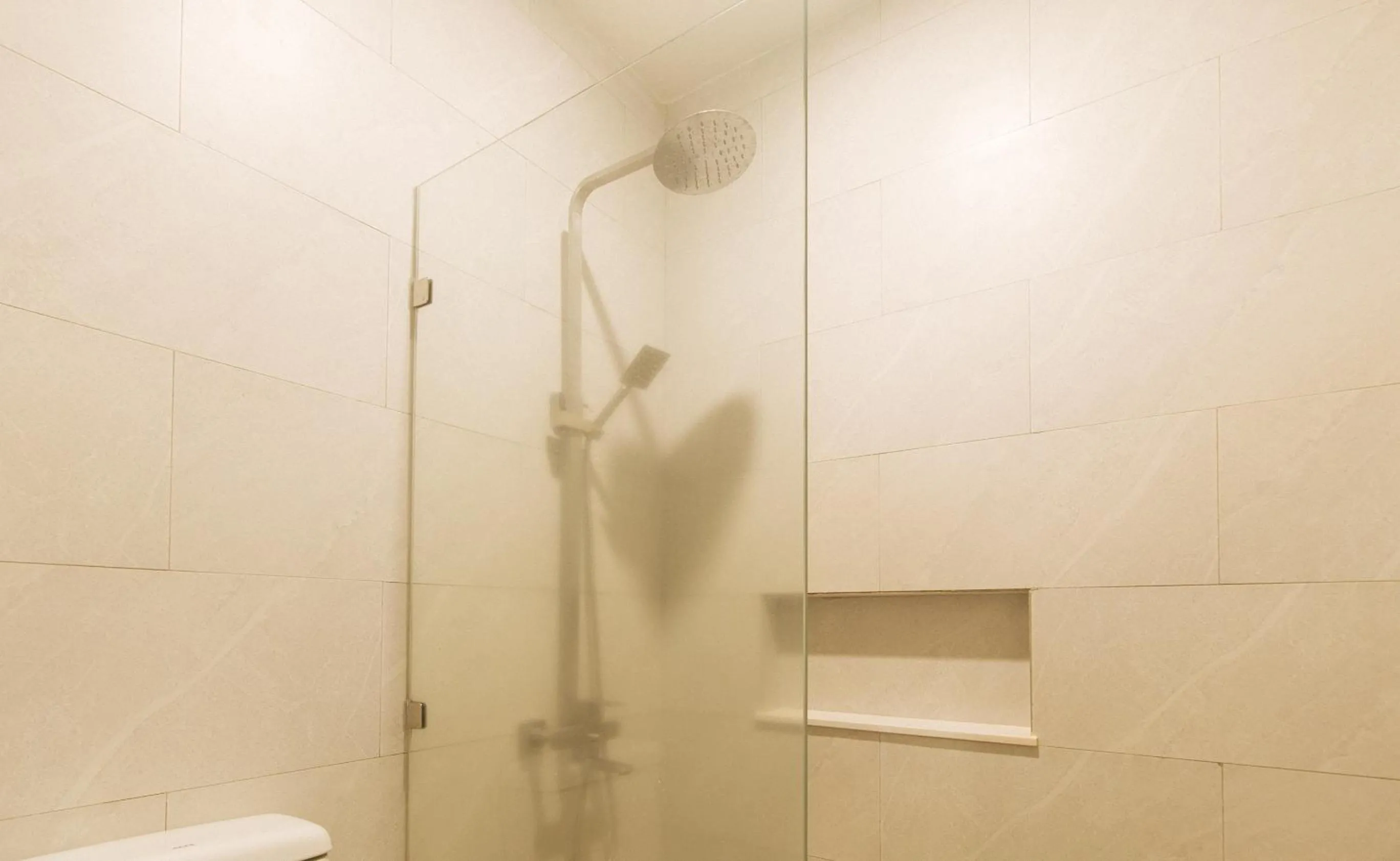 Shower in Elyseah Condotel by RedDoorz