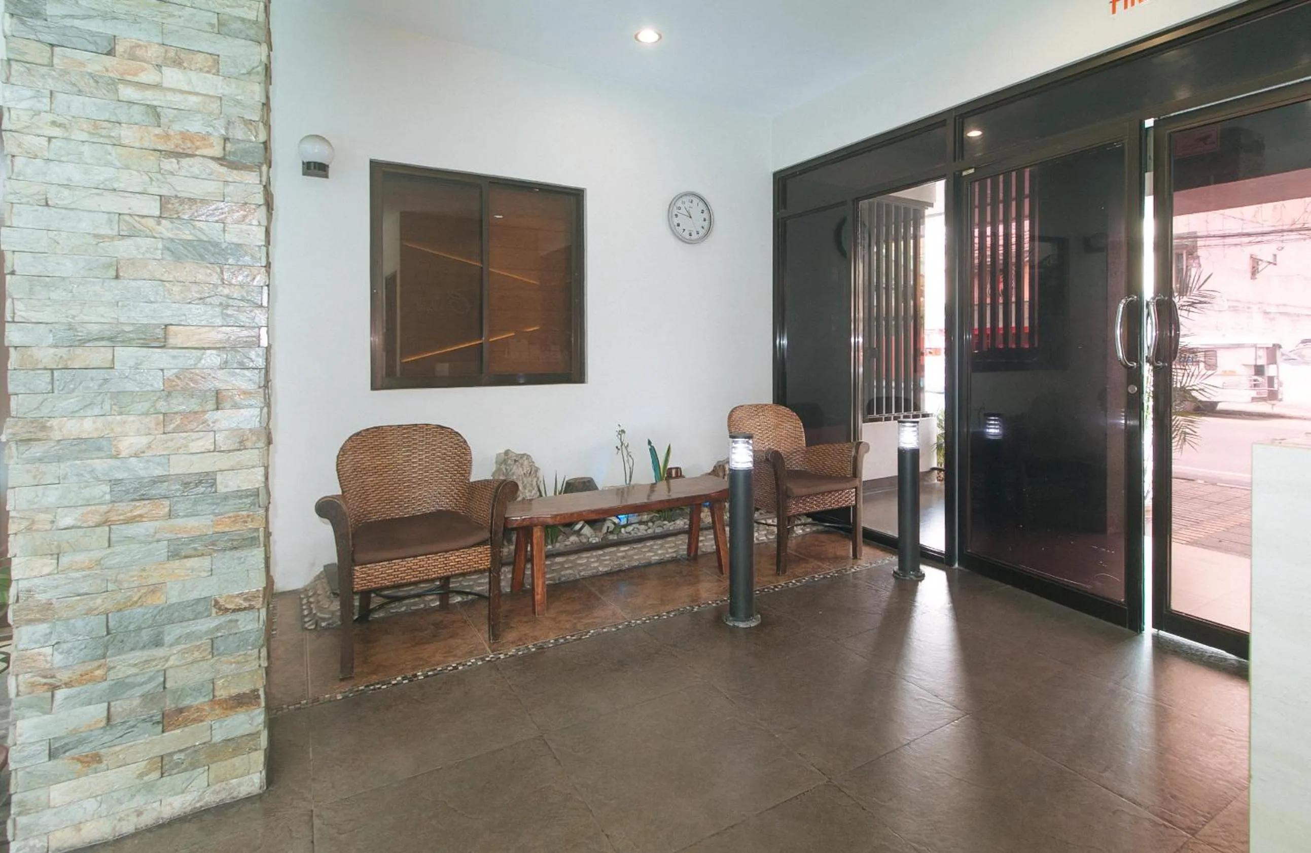 Seating area in Elyseah Condotel by RedDoorz