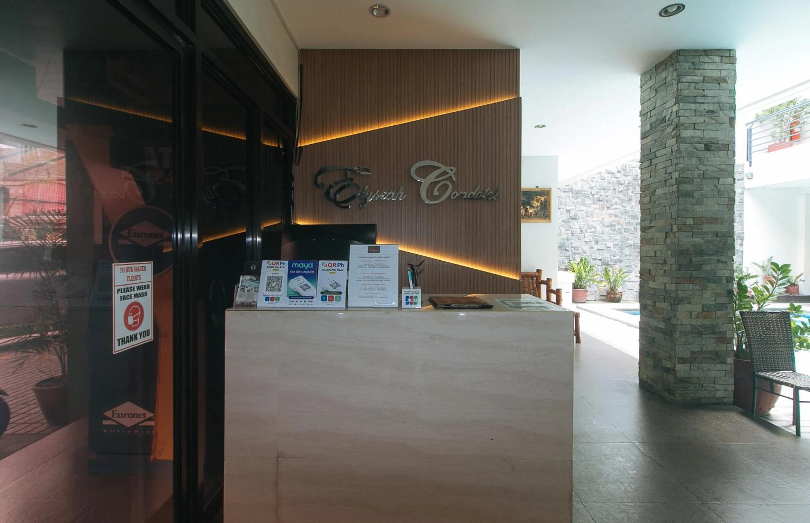 Lobby or reception in Elyseah Condotel by RedDoorz