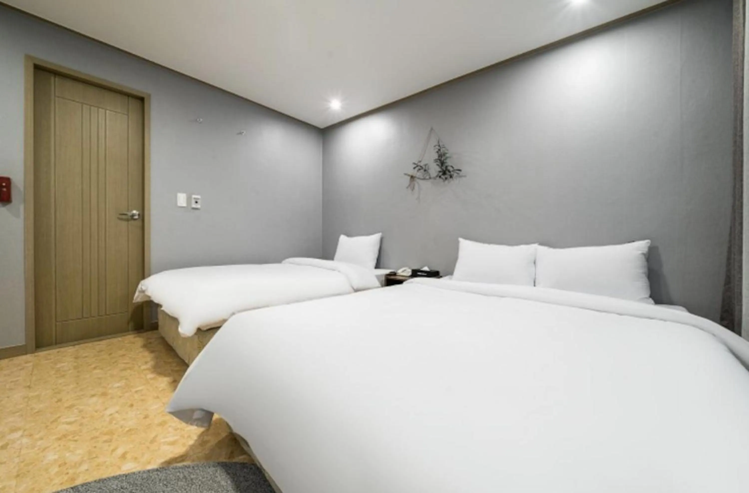 Bed in Jeju Pure Stay Ocean