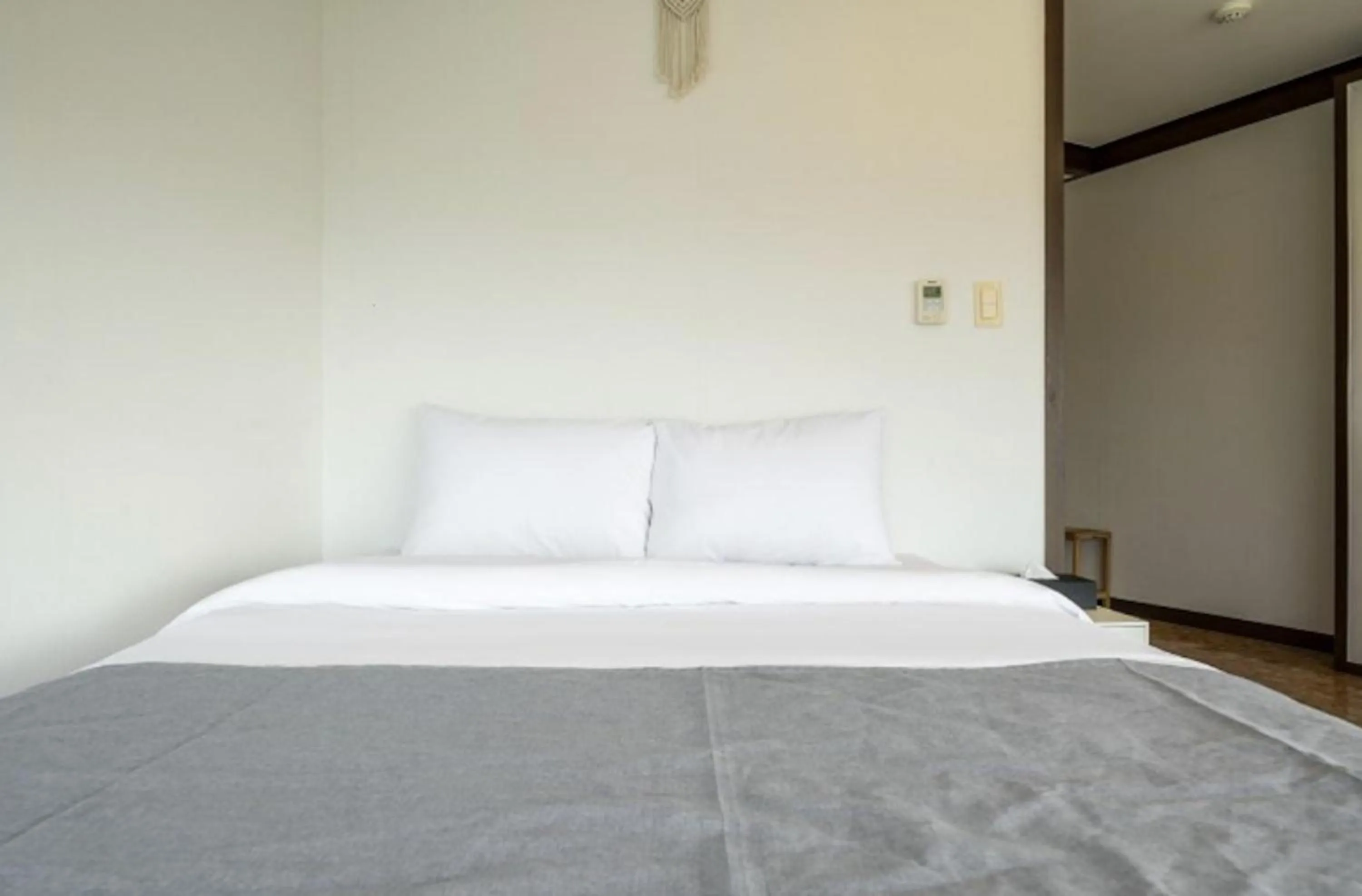 Bed in Jeju Pure Stay Ocean