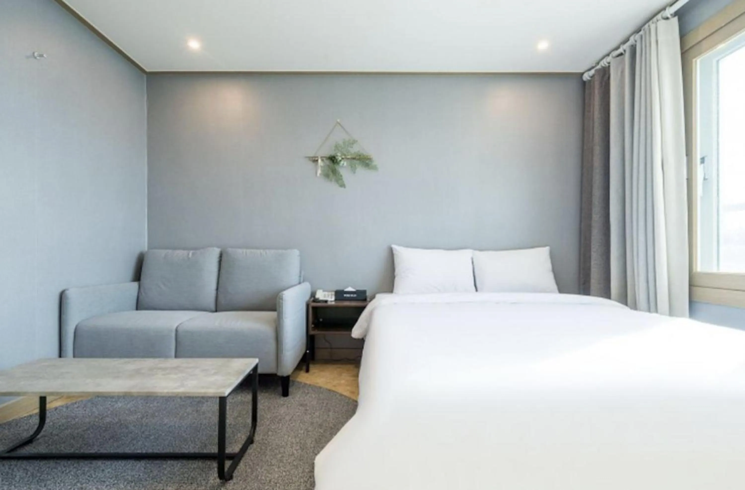 Bed in Jeju Pure Stay Ocean