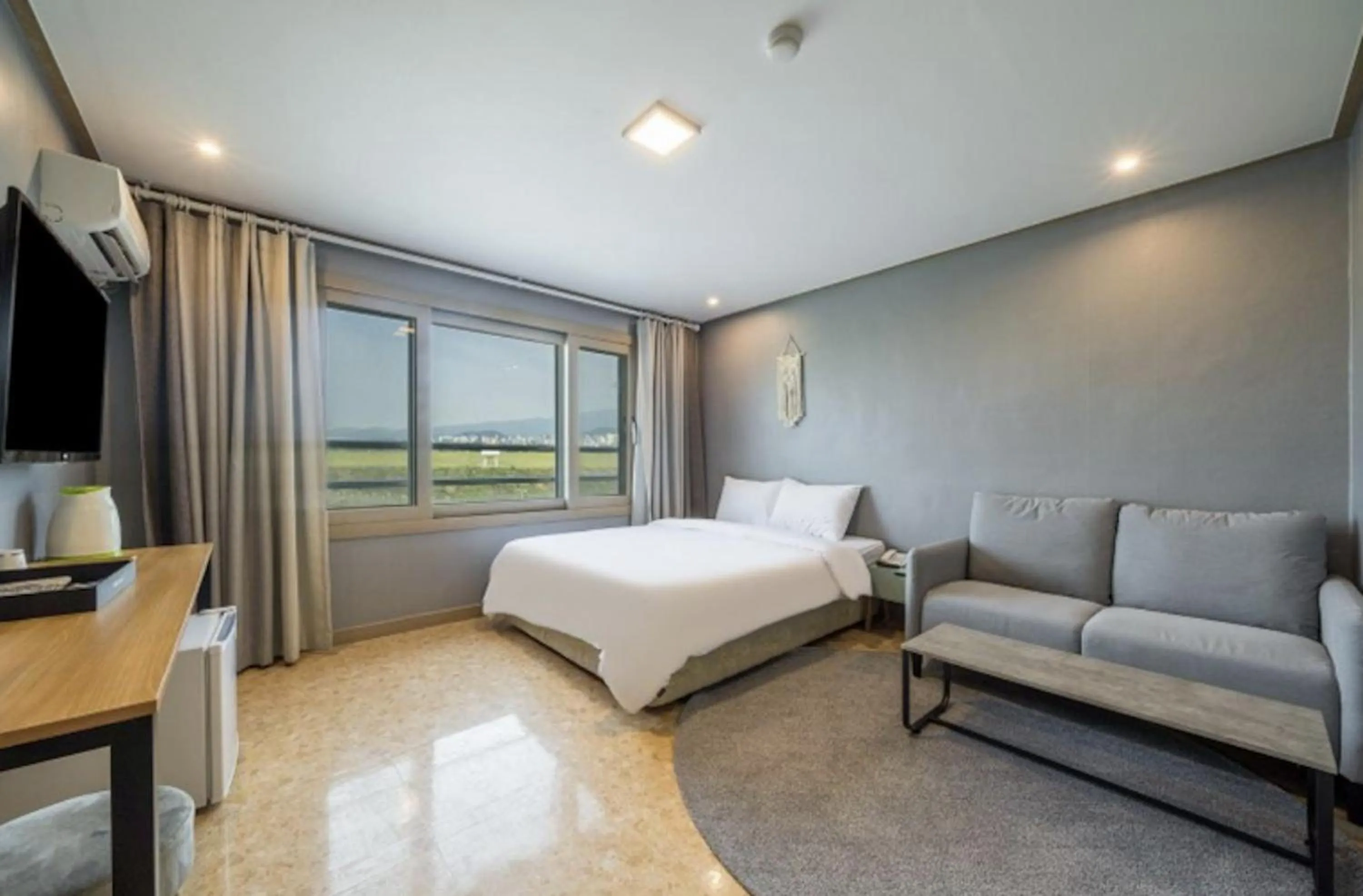 Bed in Jeju Pure Stay Ocean