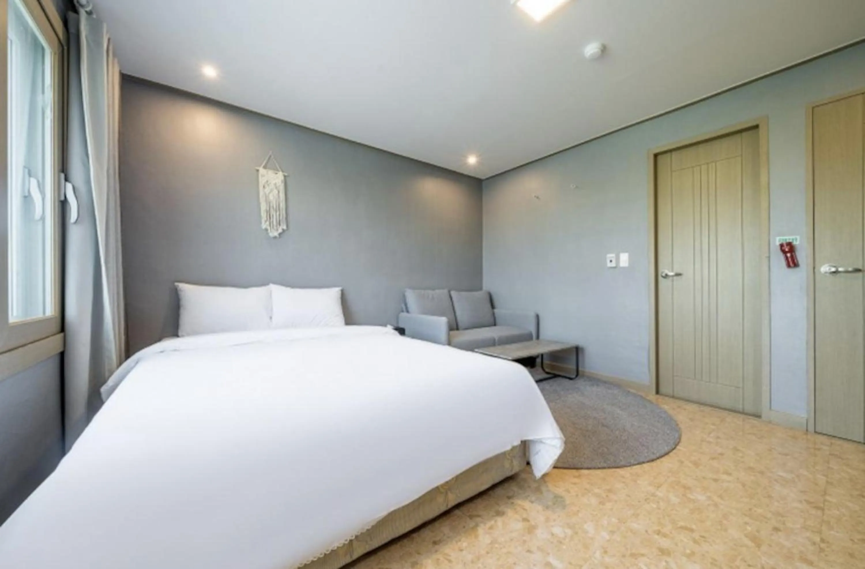 Bed in Jeju Pure Stay Ocean