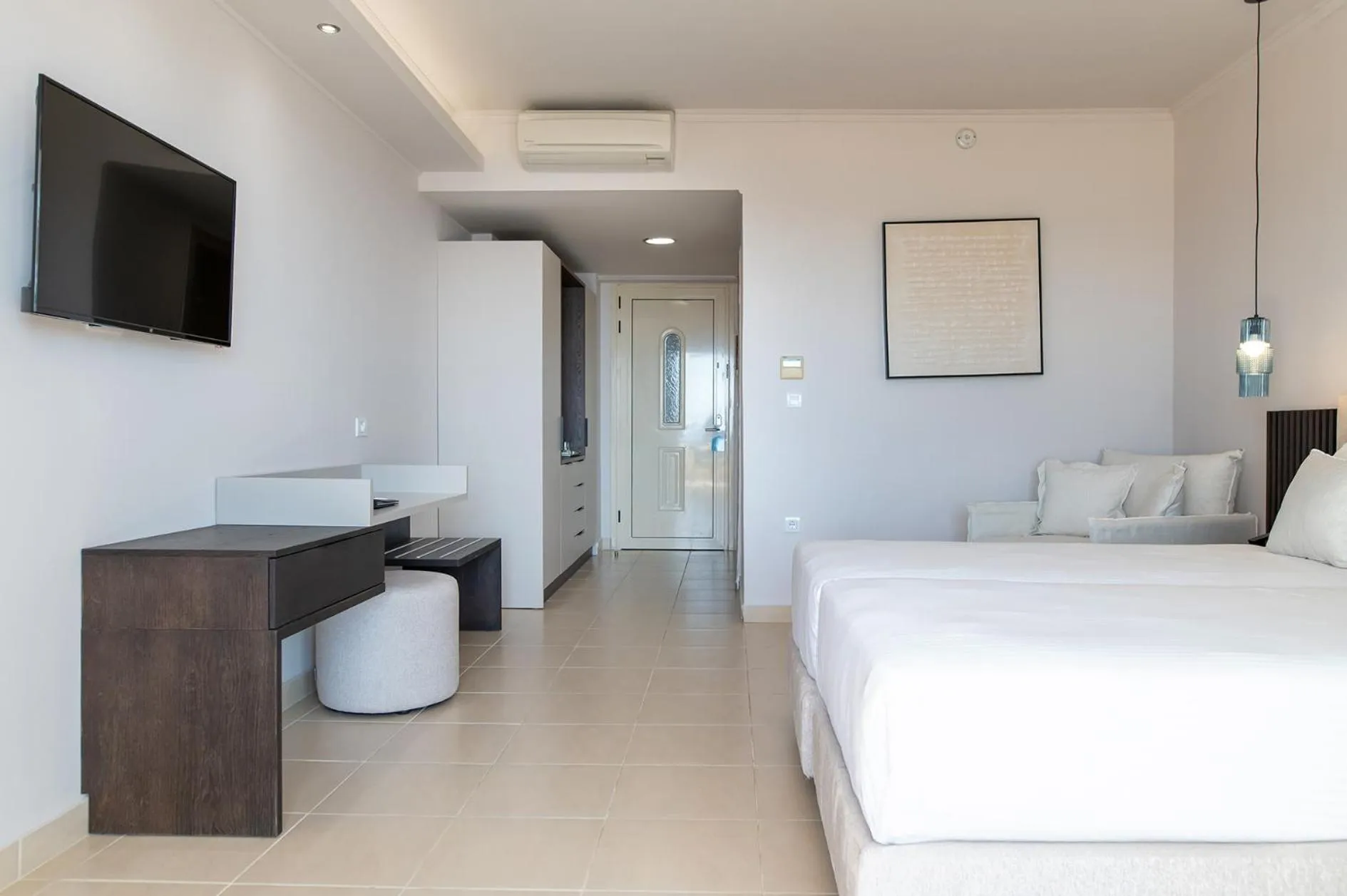 Bed in Grand Blue Beach Hotel