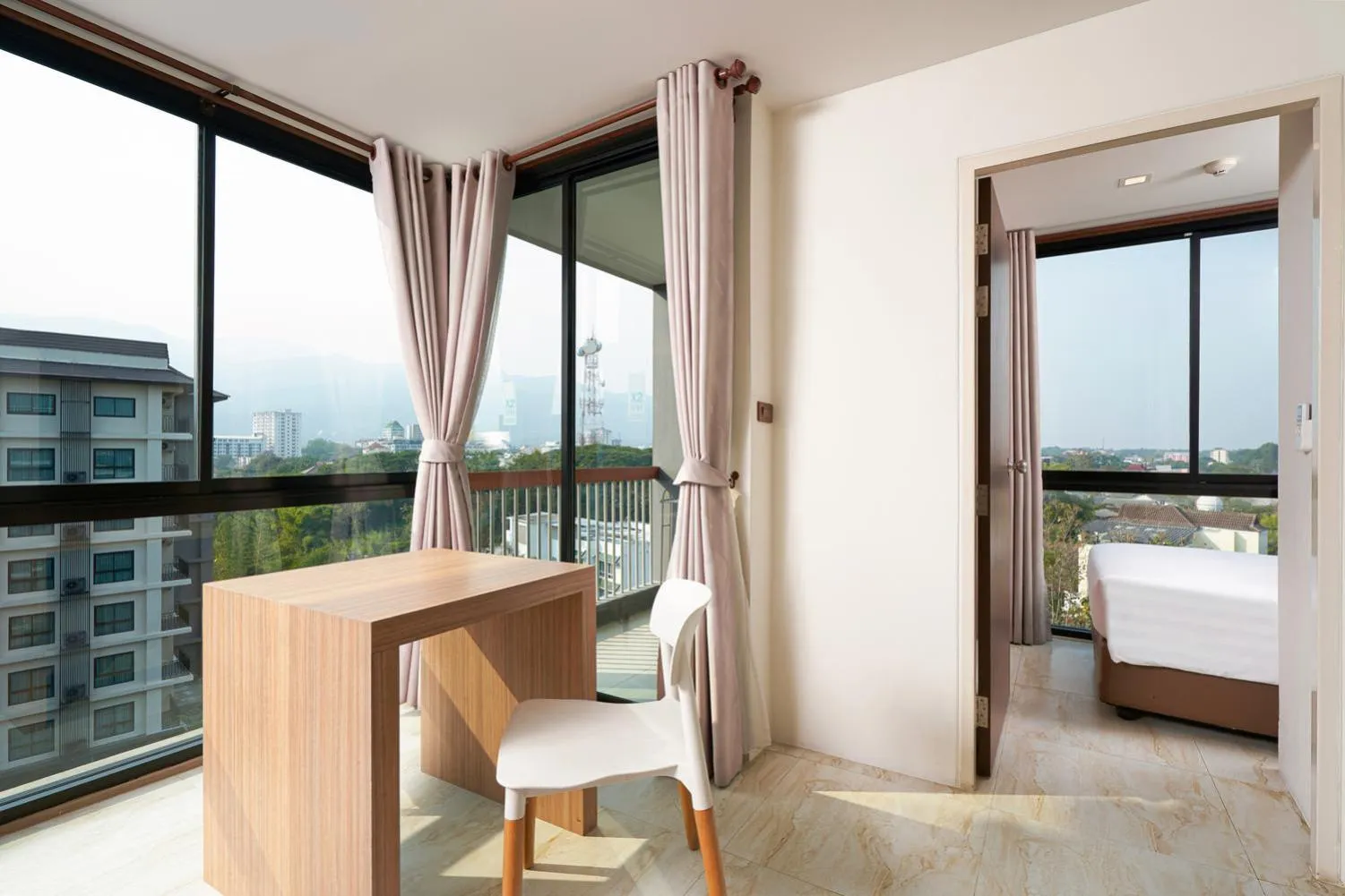 Seating area, Bed in Cross Vibe Chiang Mai Decem Nimman Hotel