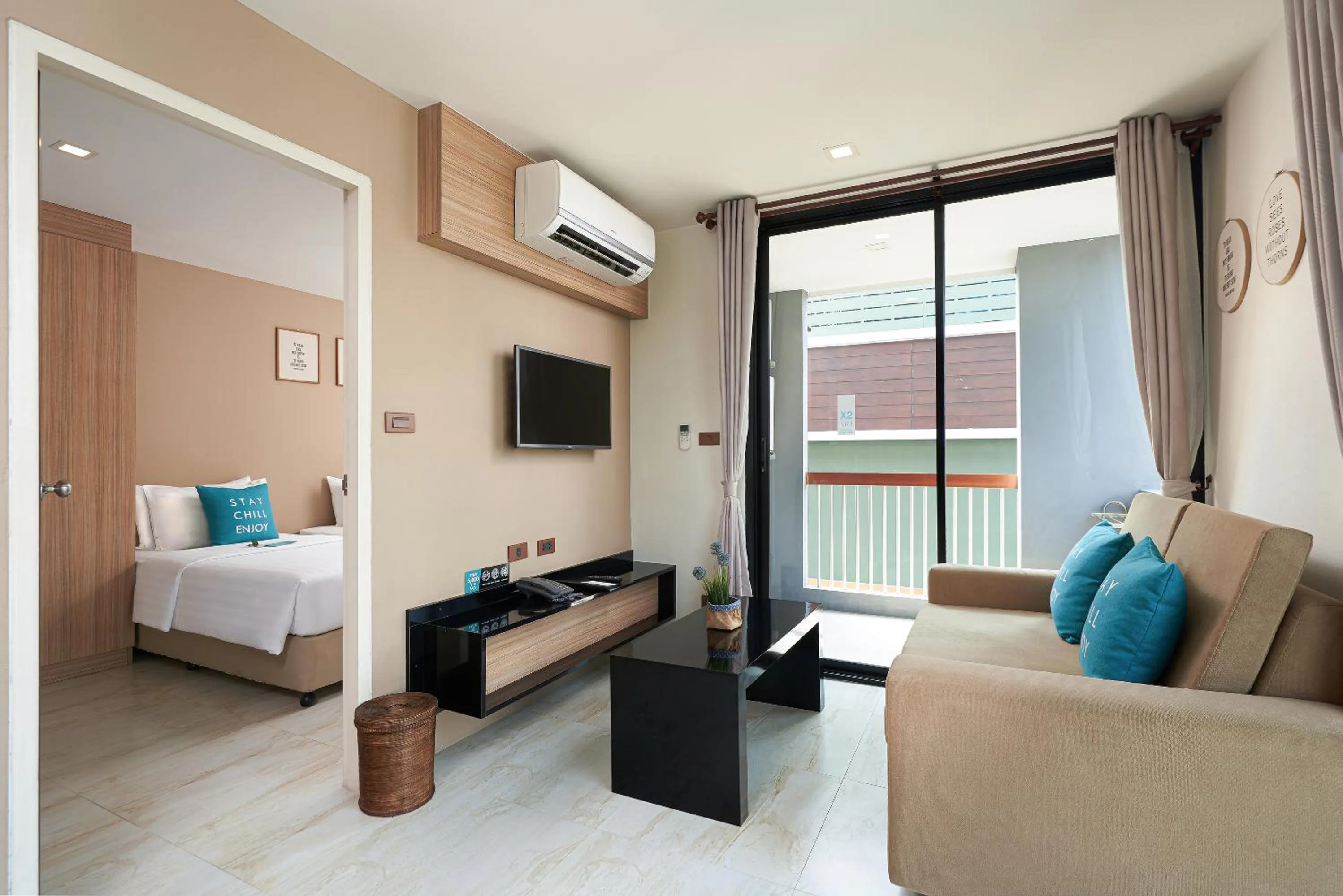 Seating area, Bed in Cross Vibe Chiang Mai Decem Nimman Hotel