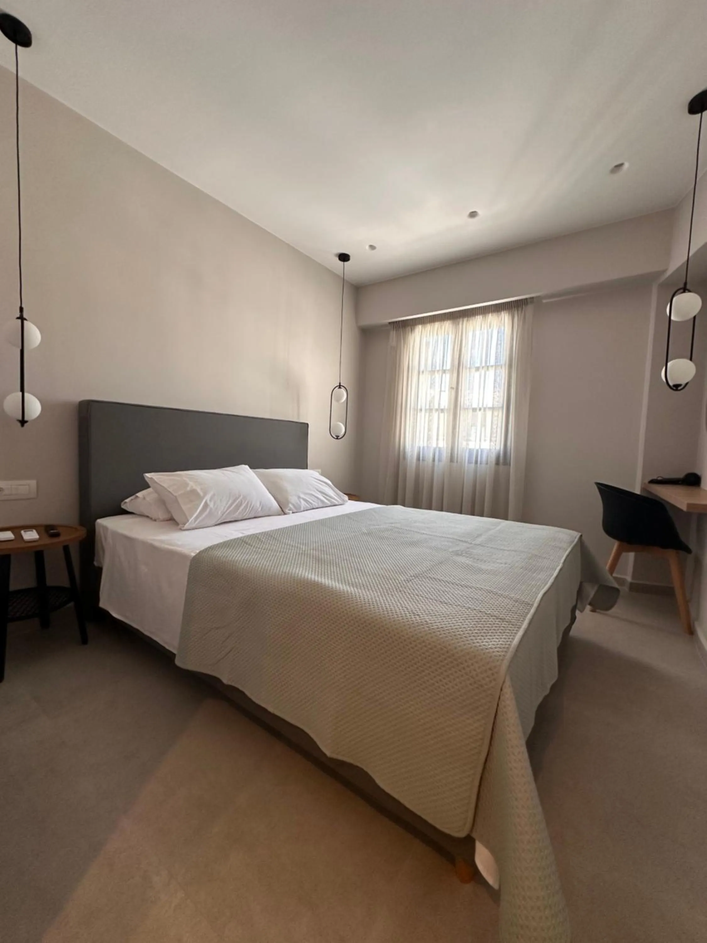 Bed in Ikaros Art Hotel