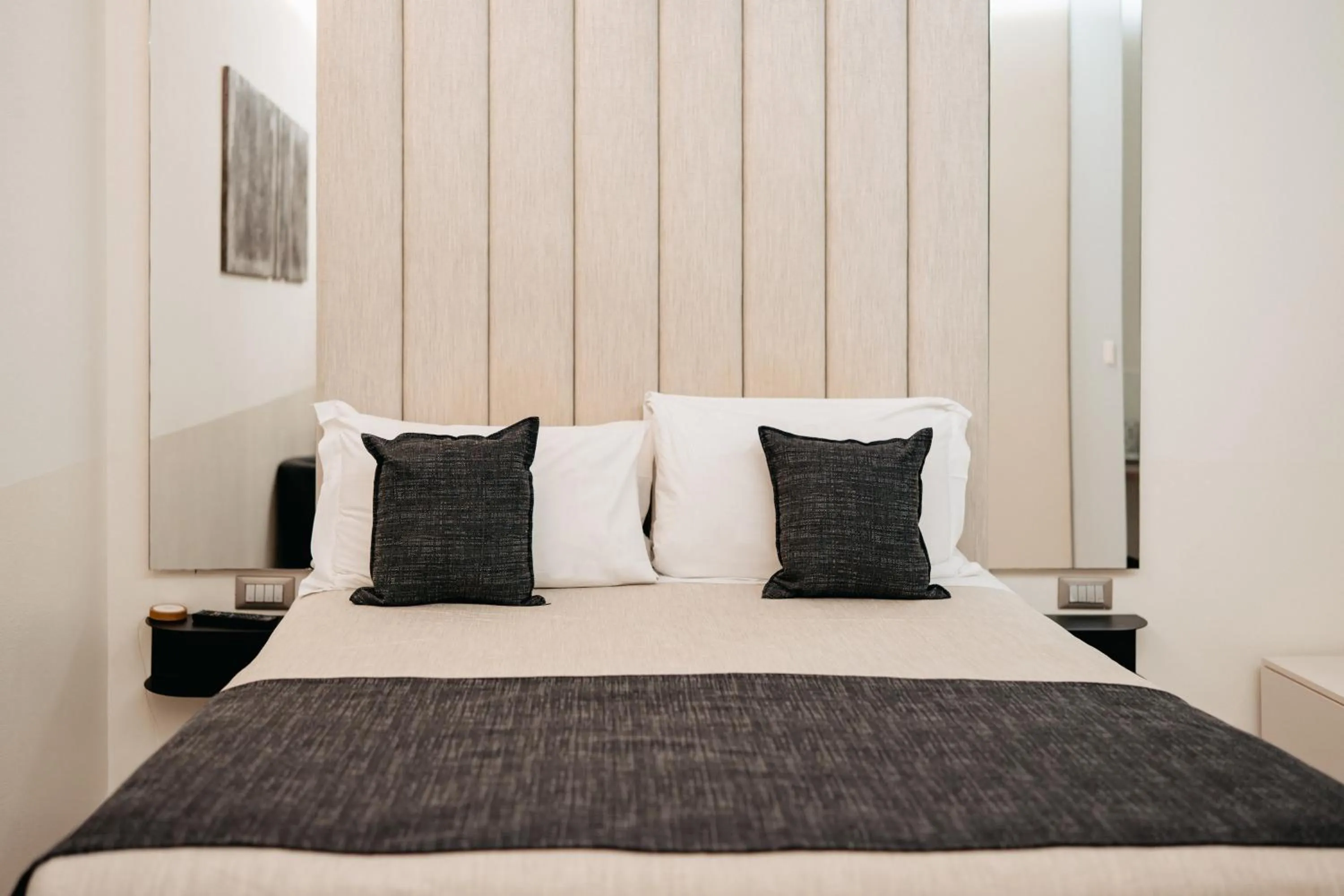 Bed in Room 230 Roma Luxury Suites