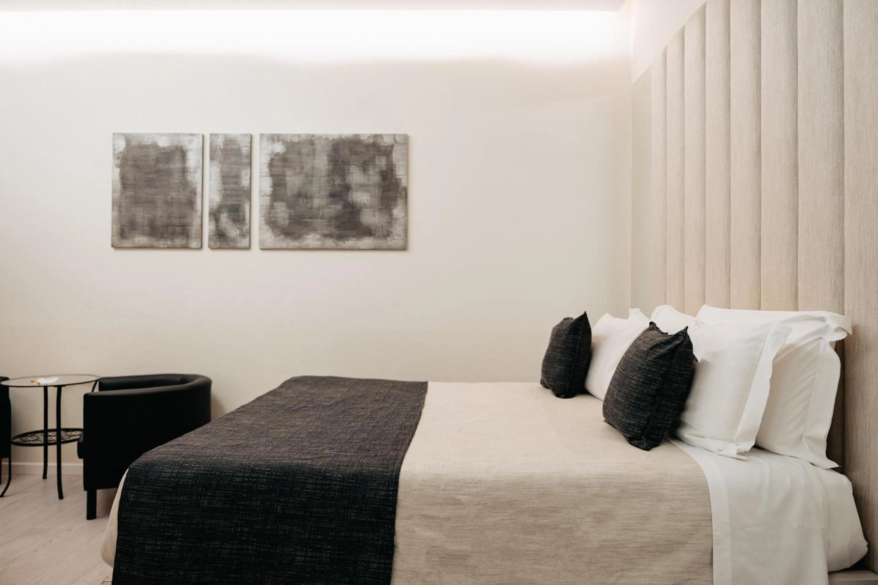 Bed in Room 230 Roma Luxury Suites