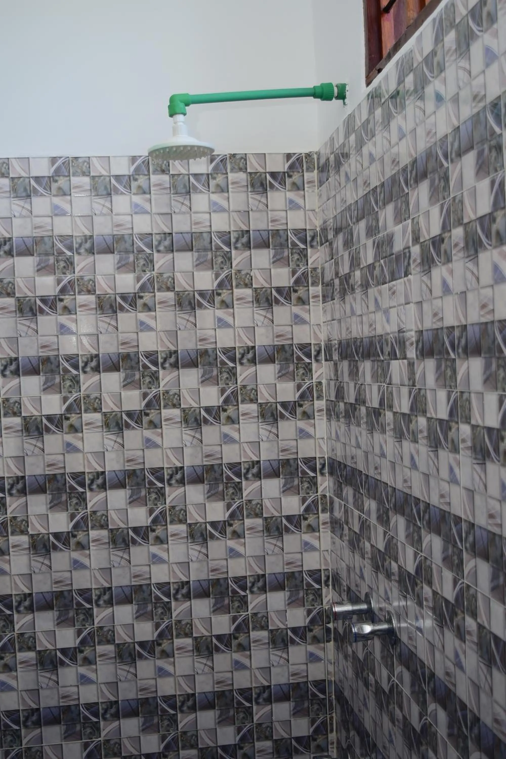 Shower in Kigwedeni Villas