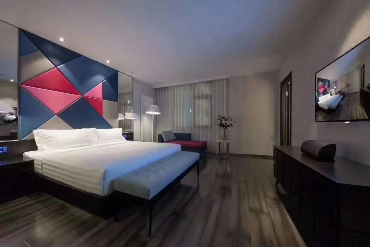 Bed in Orange Hotel Beijing Guangming Bridge