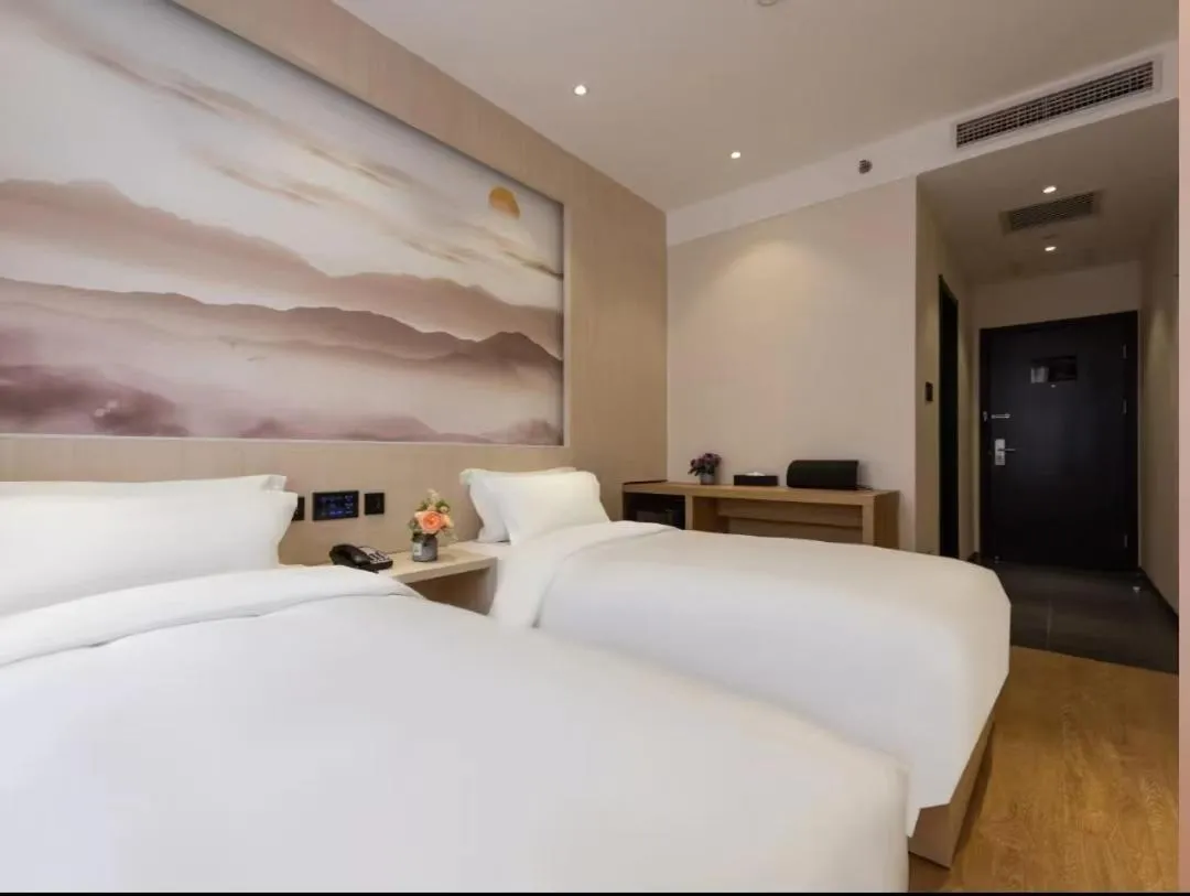 Bed in Orange Hotel Beijing Guangming Bridge