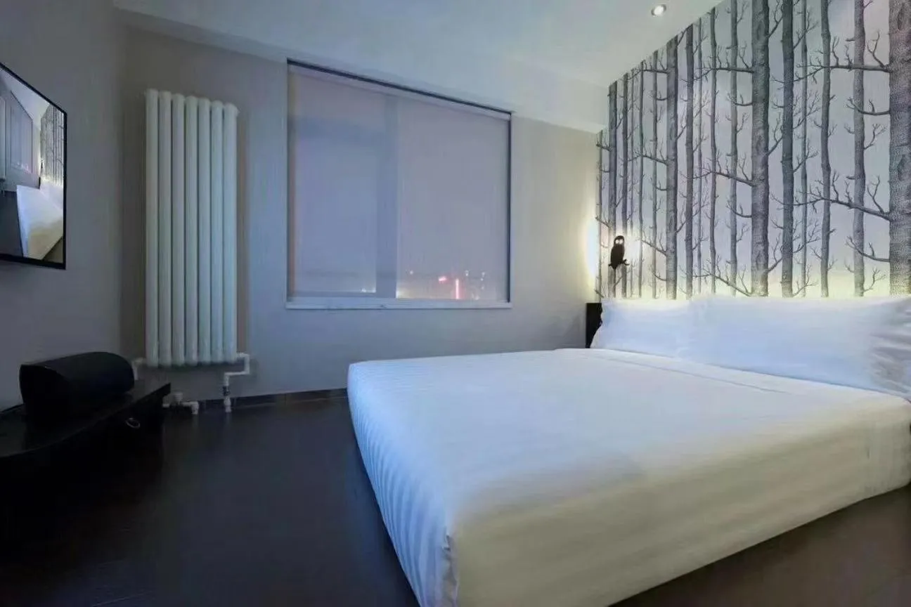 Bed in Orange Hotel Beijing Guangming Bridge
