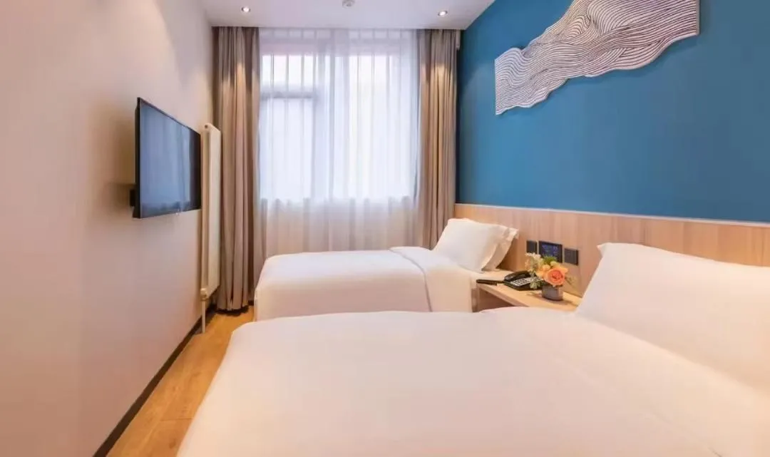 Bed in Orange Hotel Beijing Guangming Bridge