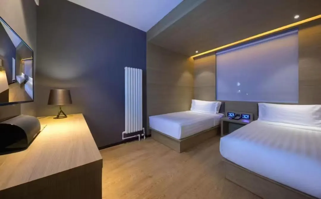 Bed in Orange Hotel Beijing Guangming Bridge
