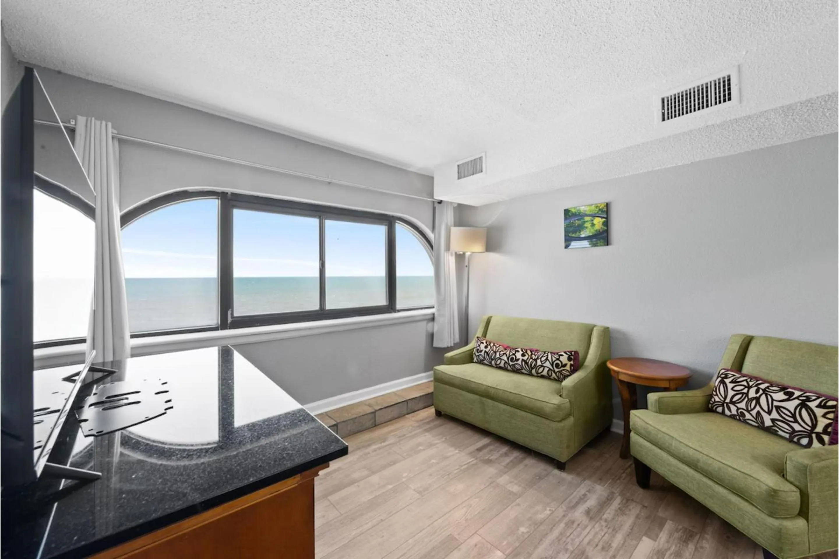 Seating area in Capital O Sunset Waves Hotel Myrtle Beach Oceanfront