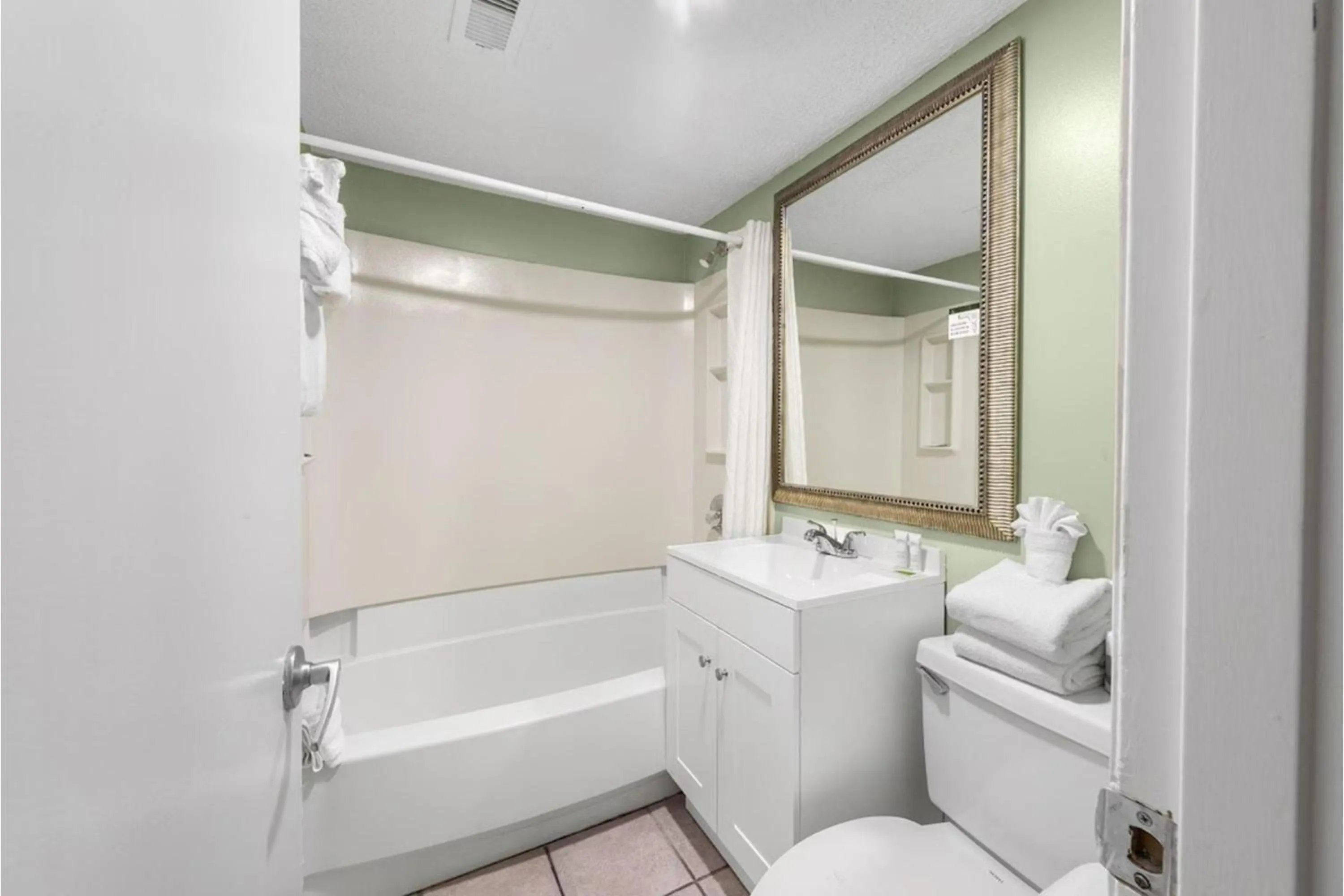 Bathroom in Capital O Sunset Waves Hotel Myrtle Beach Oceanfront