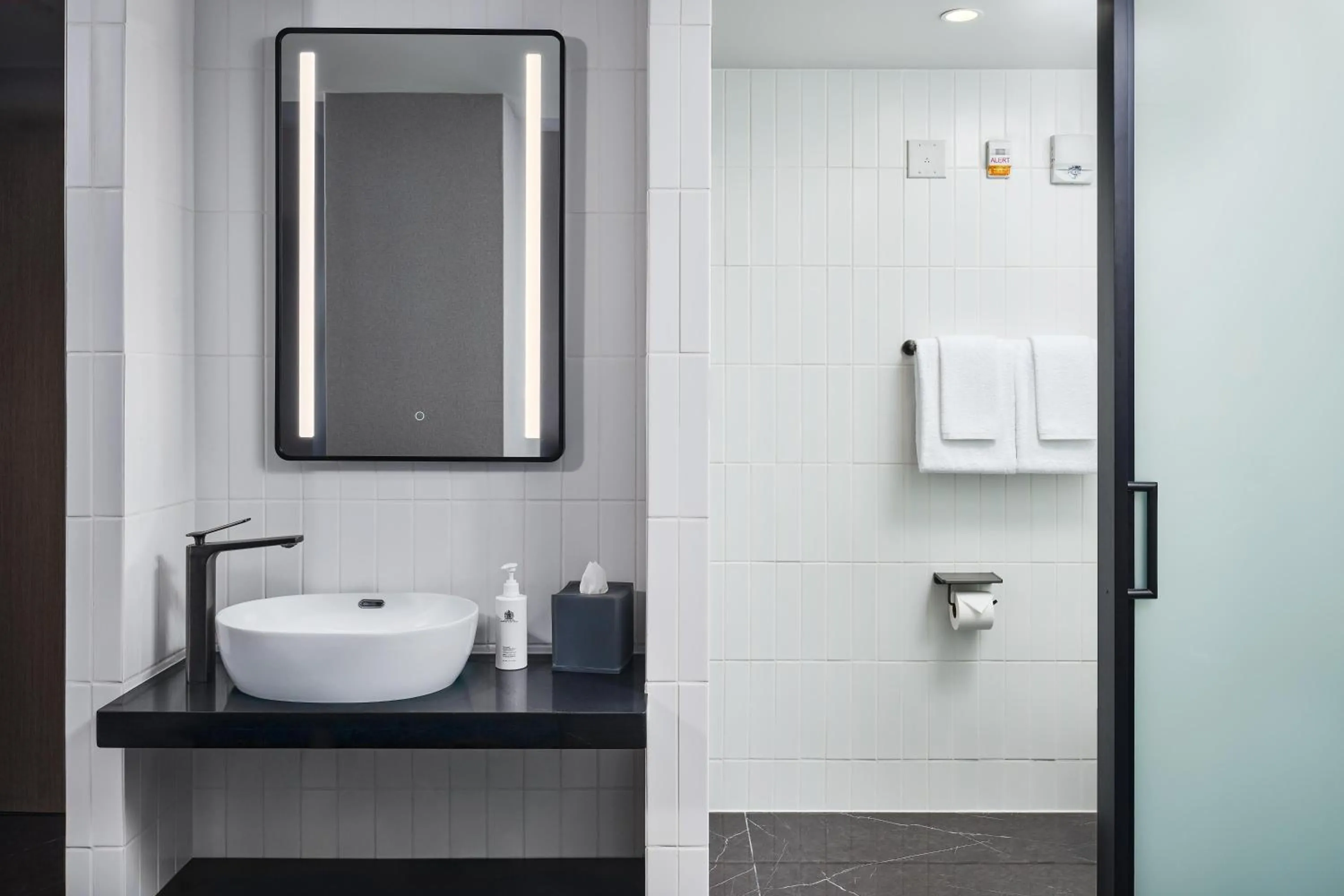 Bathroom in The George Manhattan, Tapestry Collection By Hilton