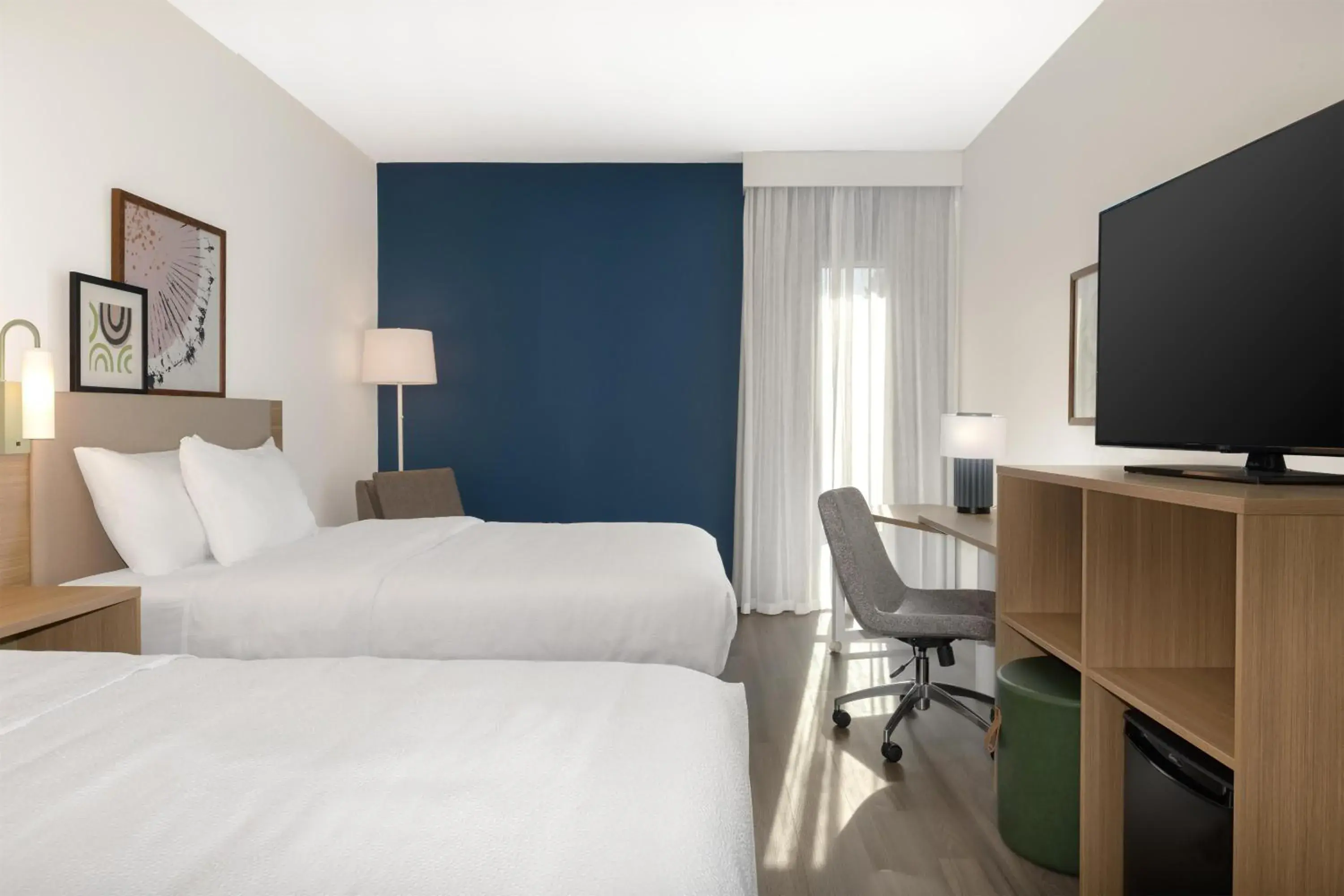 Communal lounge/ TV room, Bed in Spark By Hilton Montreal Midtown Communal lounge/ TV room, Bed in Spark By Hilton Montreal Midtown