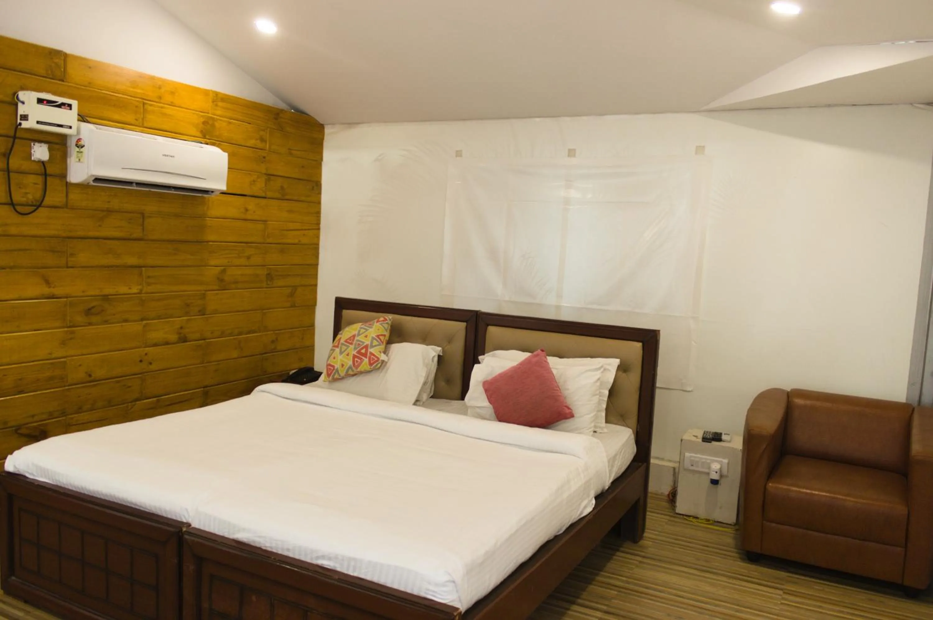 Bed in Mrugavani Resort & Spa
