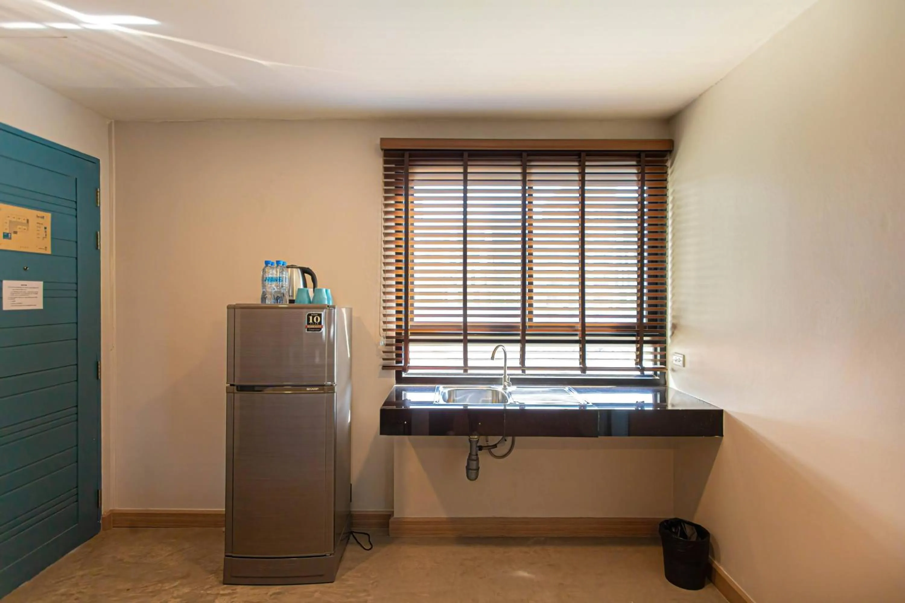 Kitchen or kitchenette in Suntria Hotel Pattaya