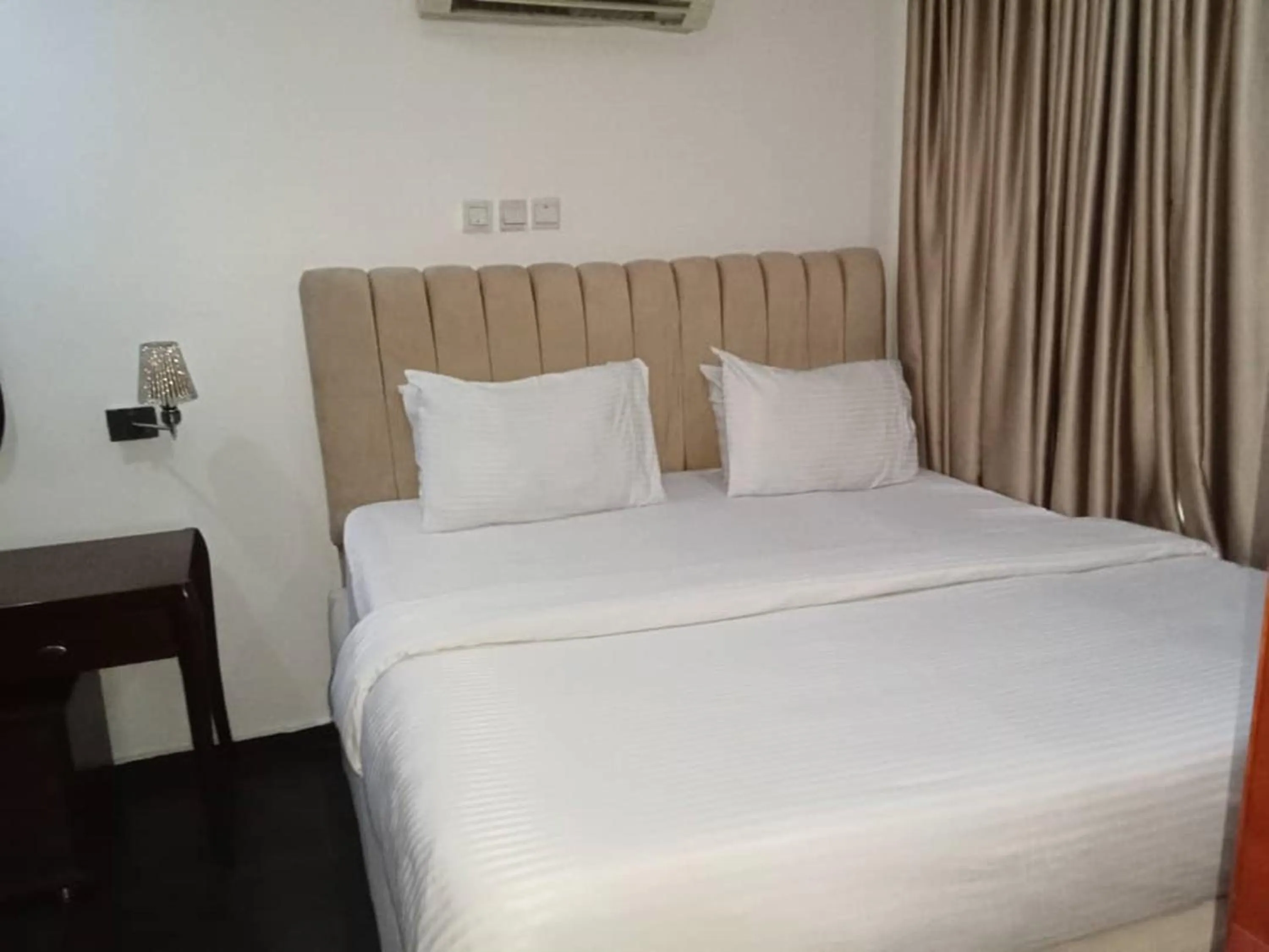 Bed in Lake 47 Suites Ltd