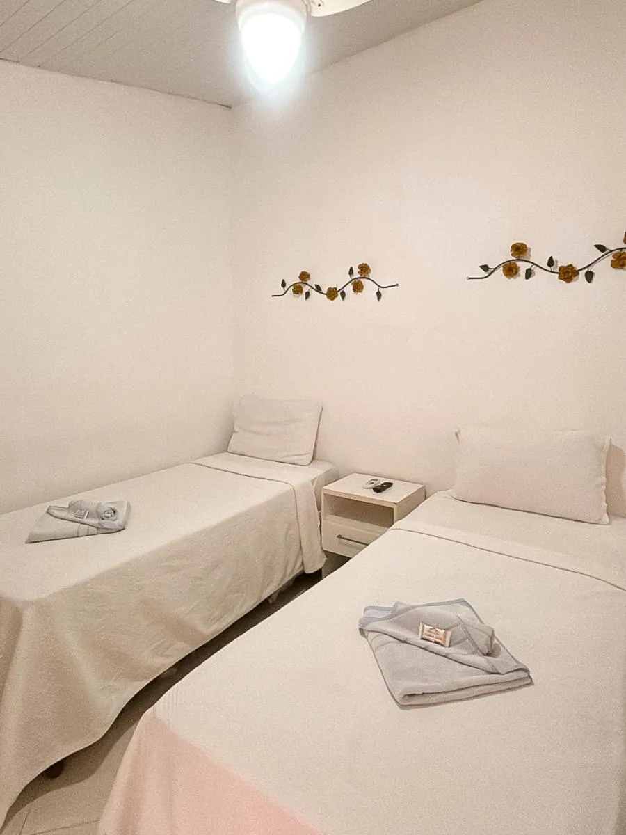 Bed in Pousada Praia e Conforto