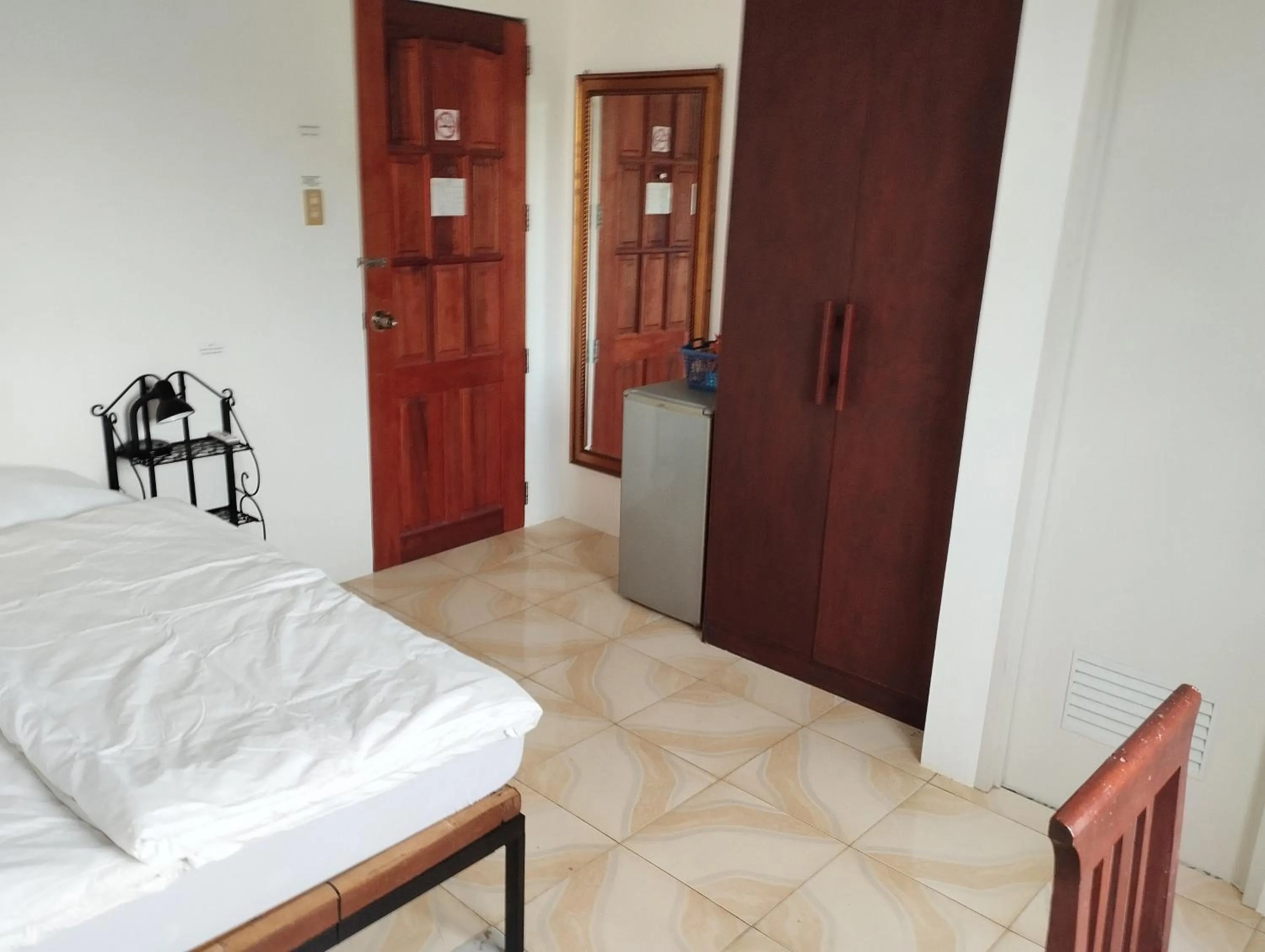 Bed in Roger's Place Guesthouse