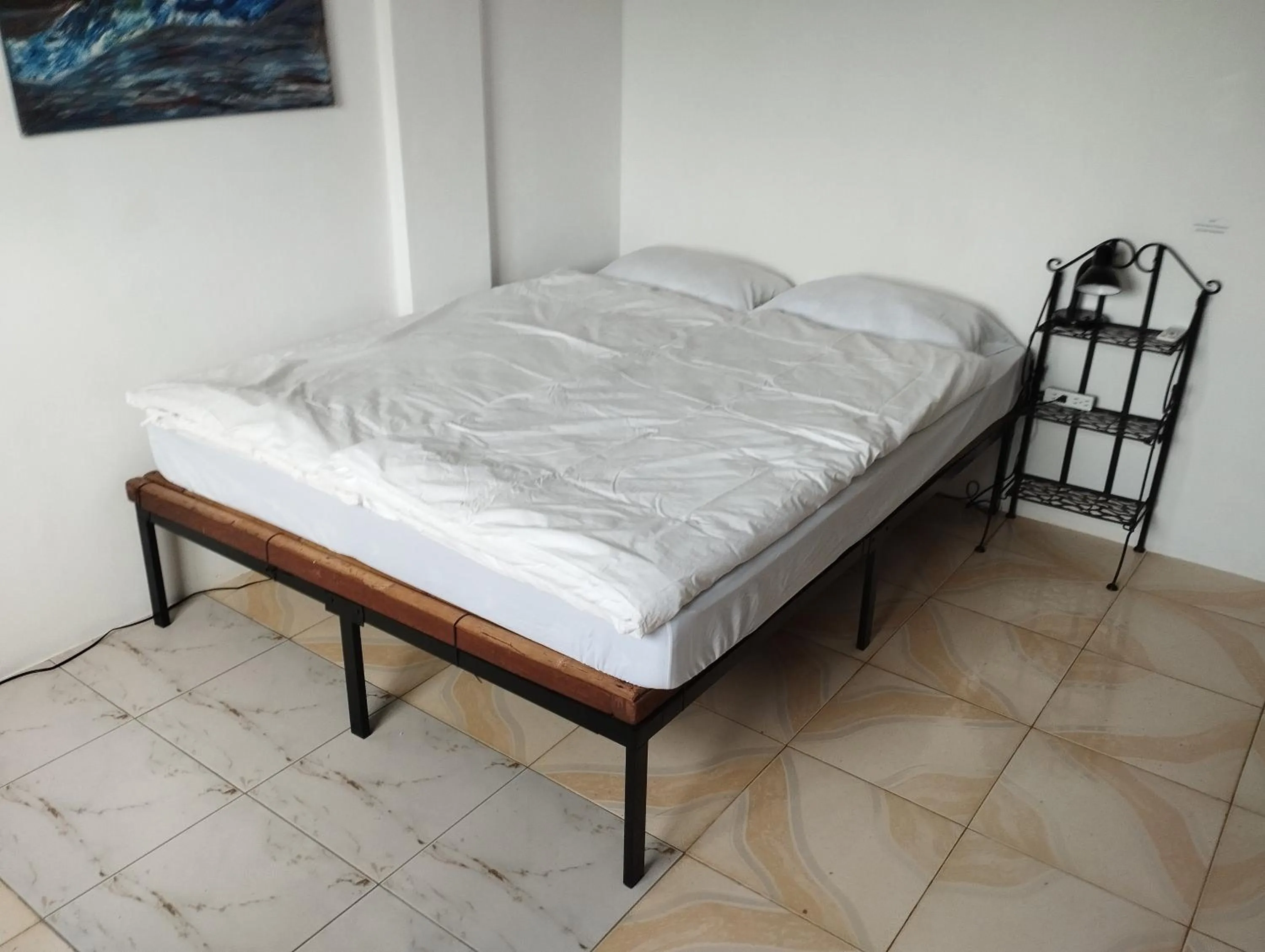 Bed in Roger's Place Guesthouse