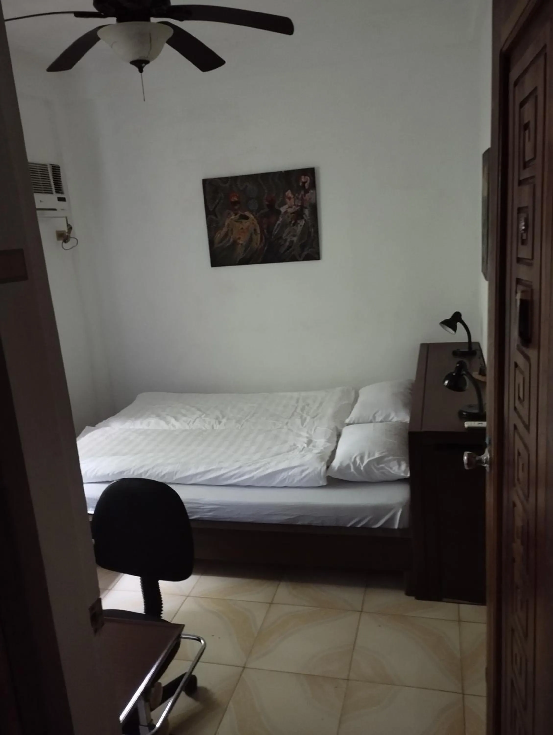 Bed in Roger's Place Guesthouse