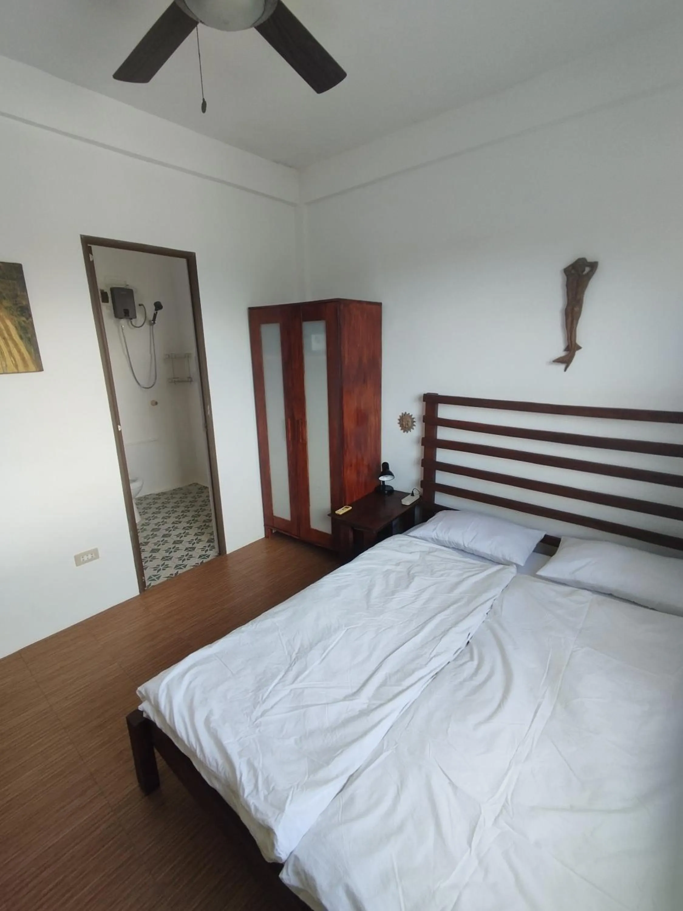 Bed in Roger's Place Guesthouse