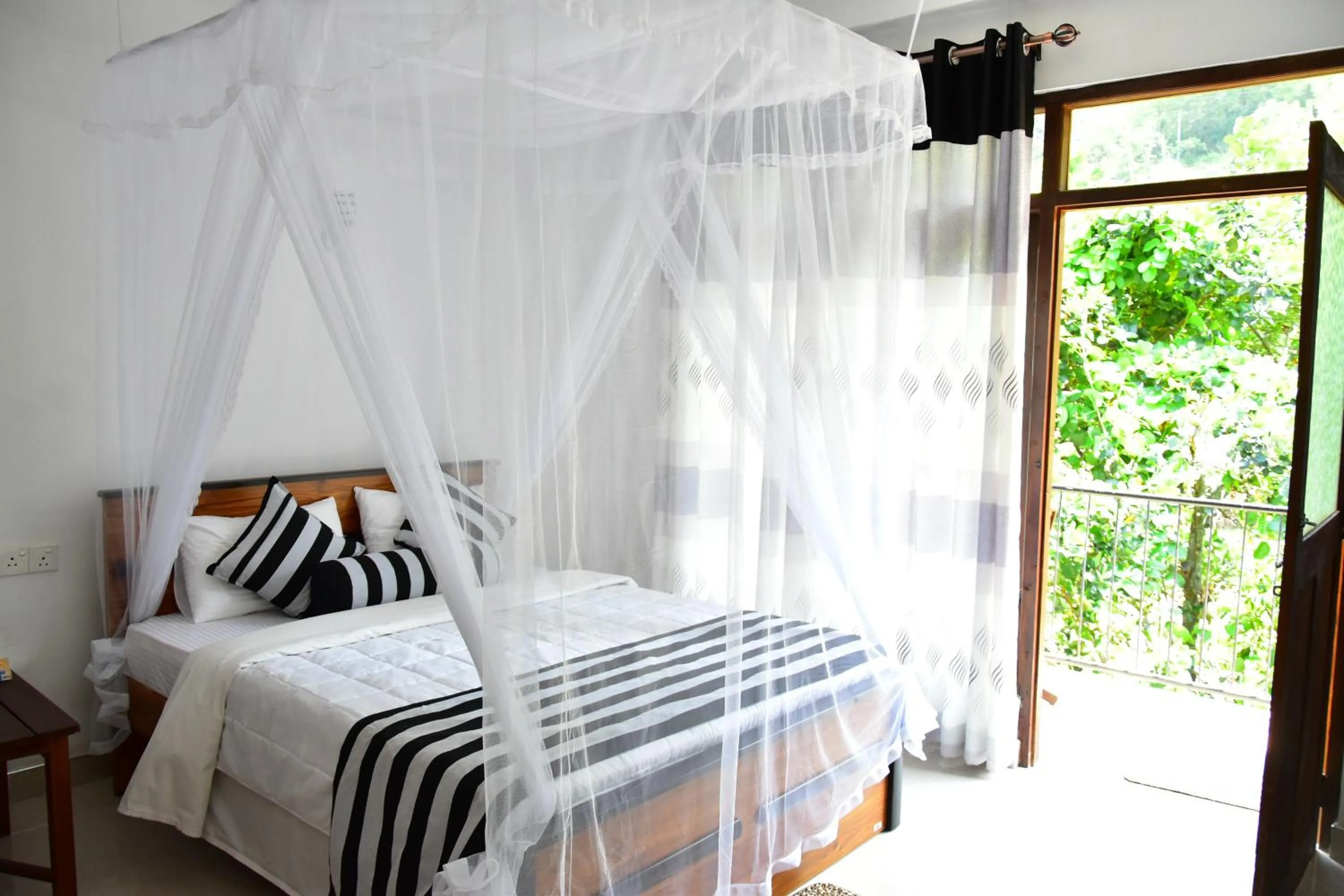 Triple Room with Balcony in River Splendour Home Stay