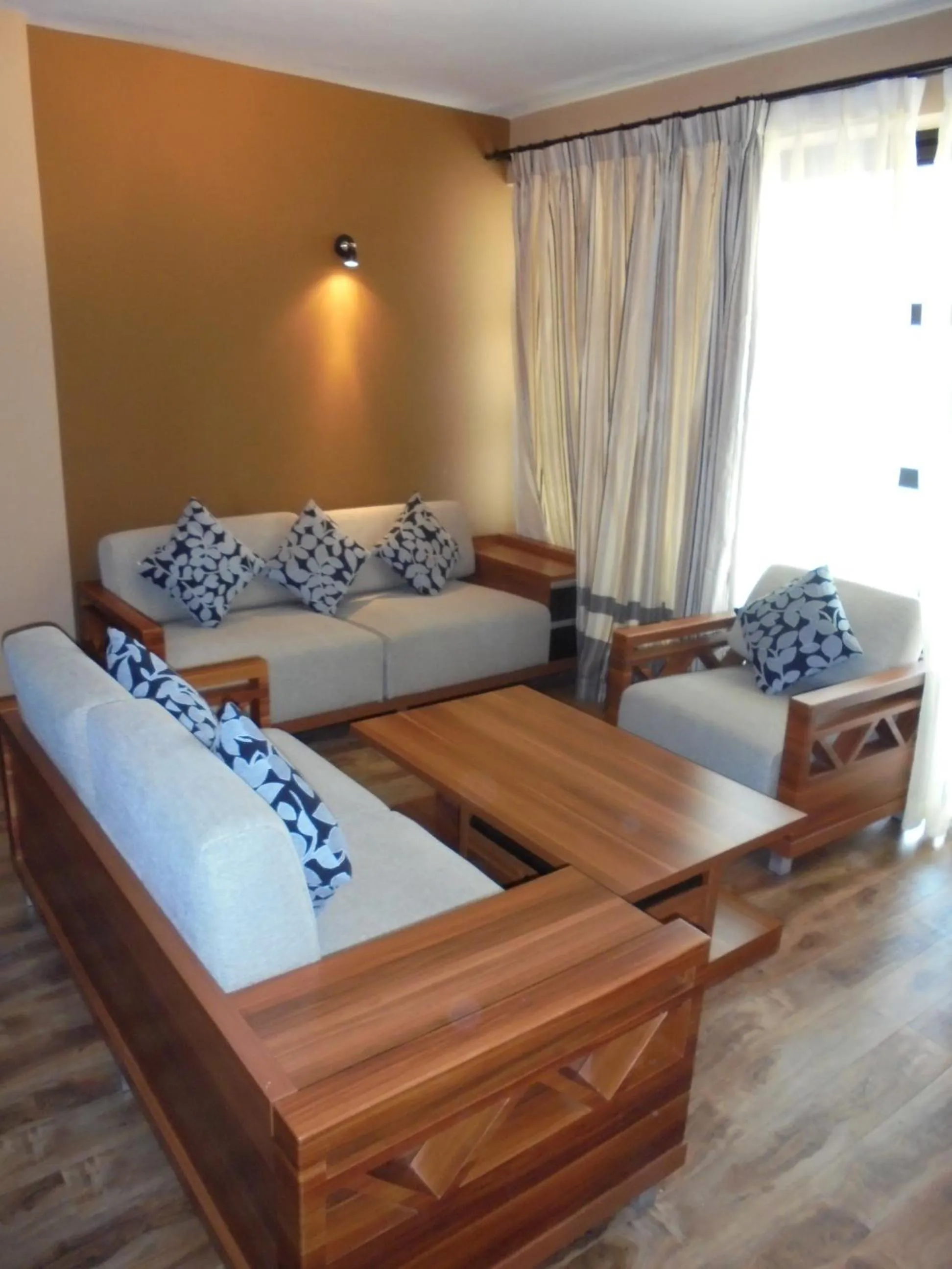 Living room, Bed in We Hotel and Suites