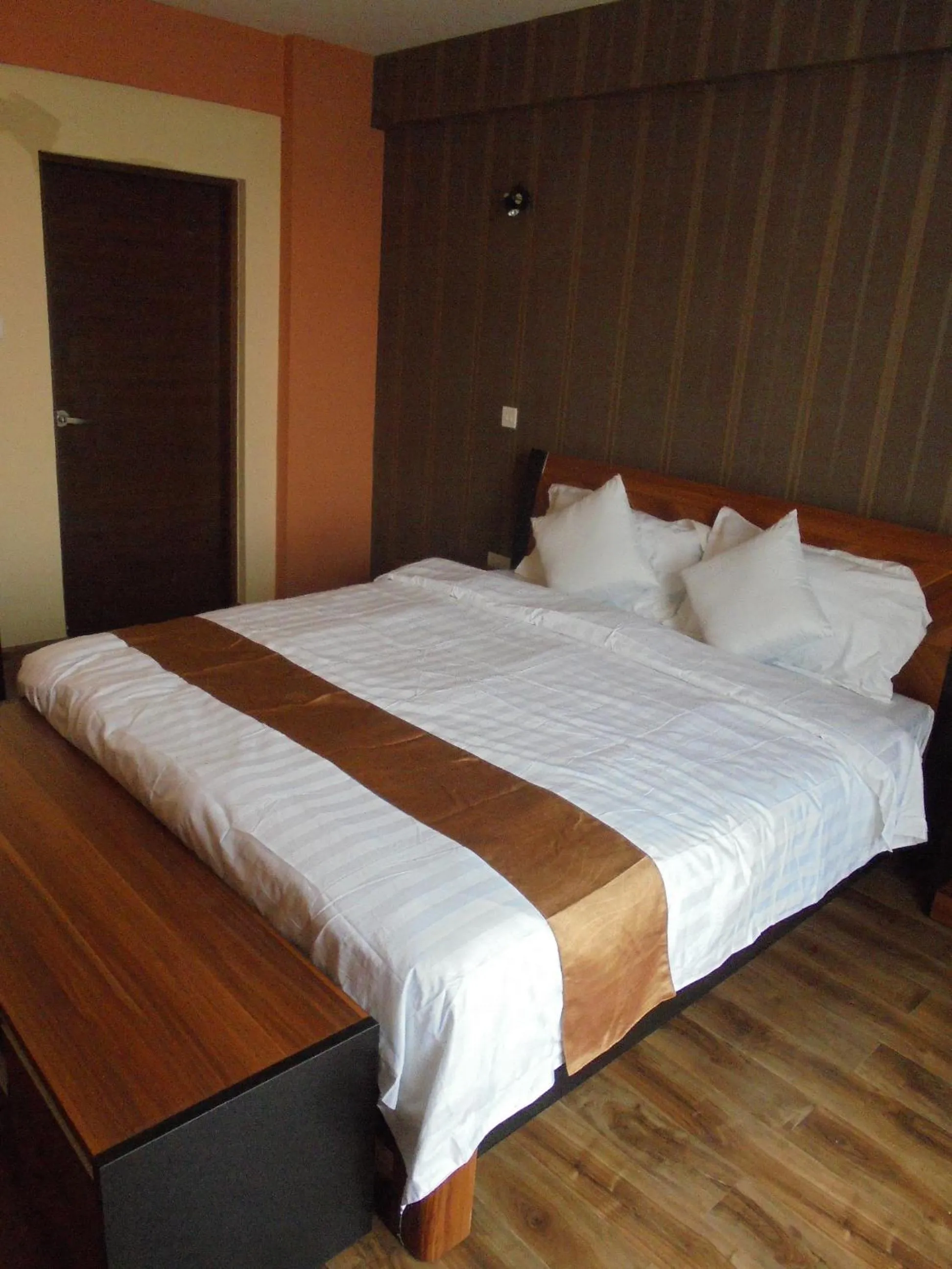 Bed in We Hotel and Suites